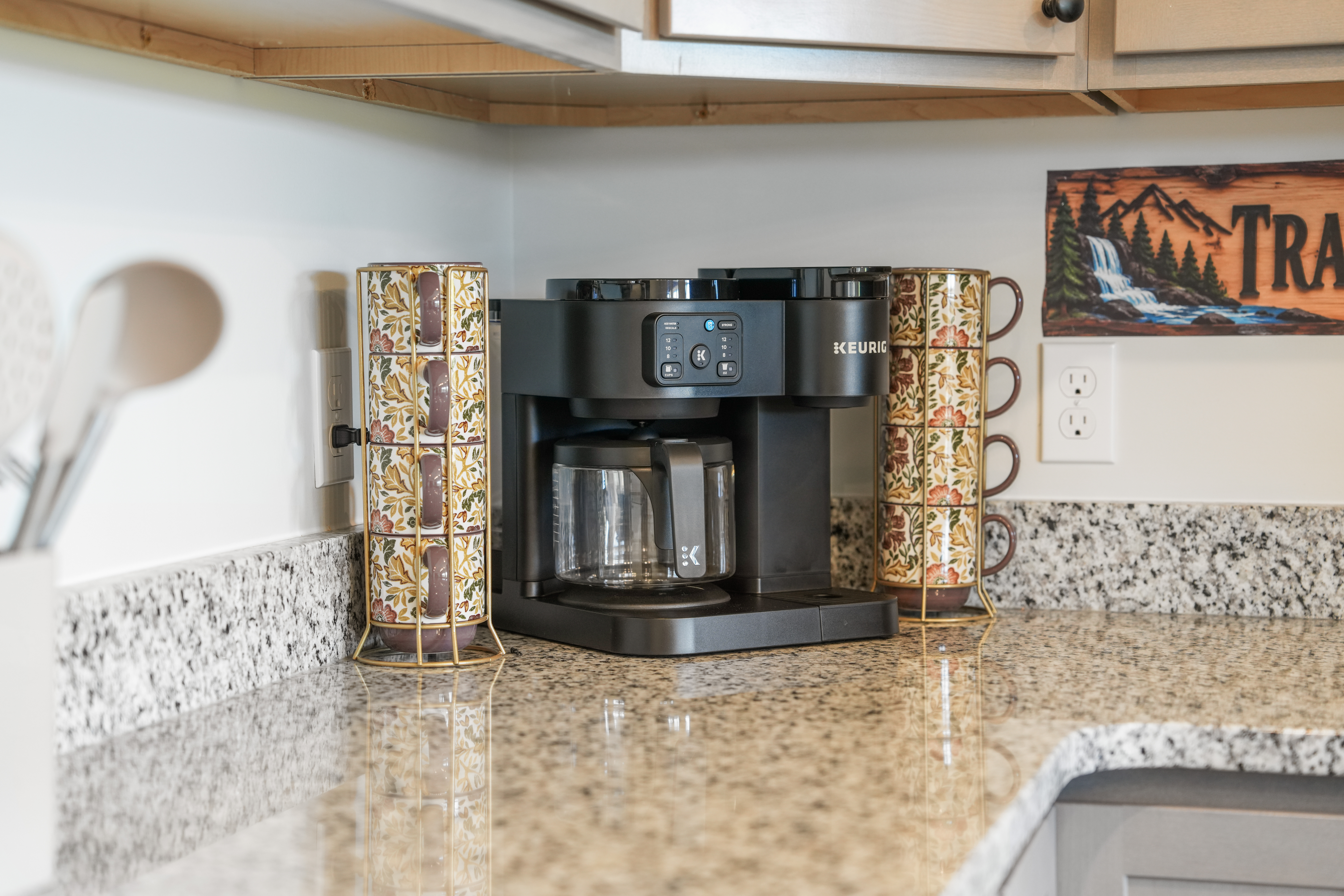 Inviting kitchen coffee station with Keurig and spacious granite counters
