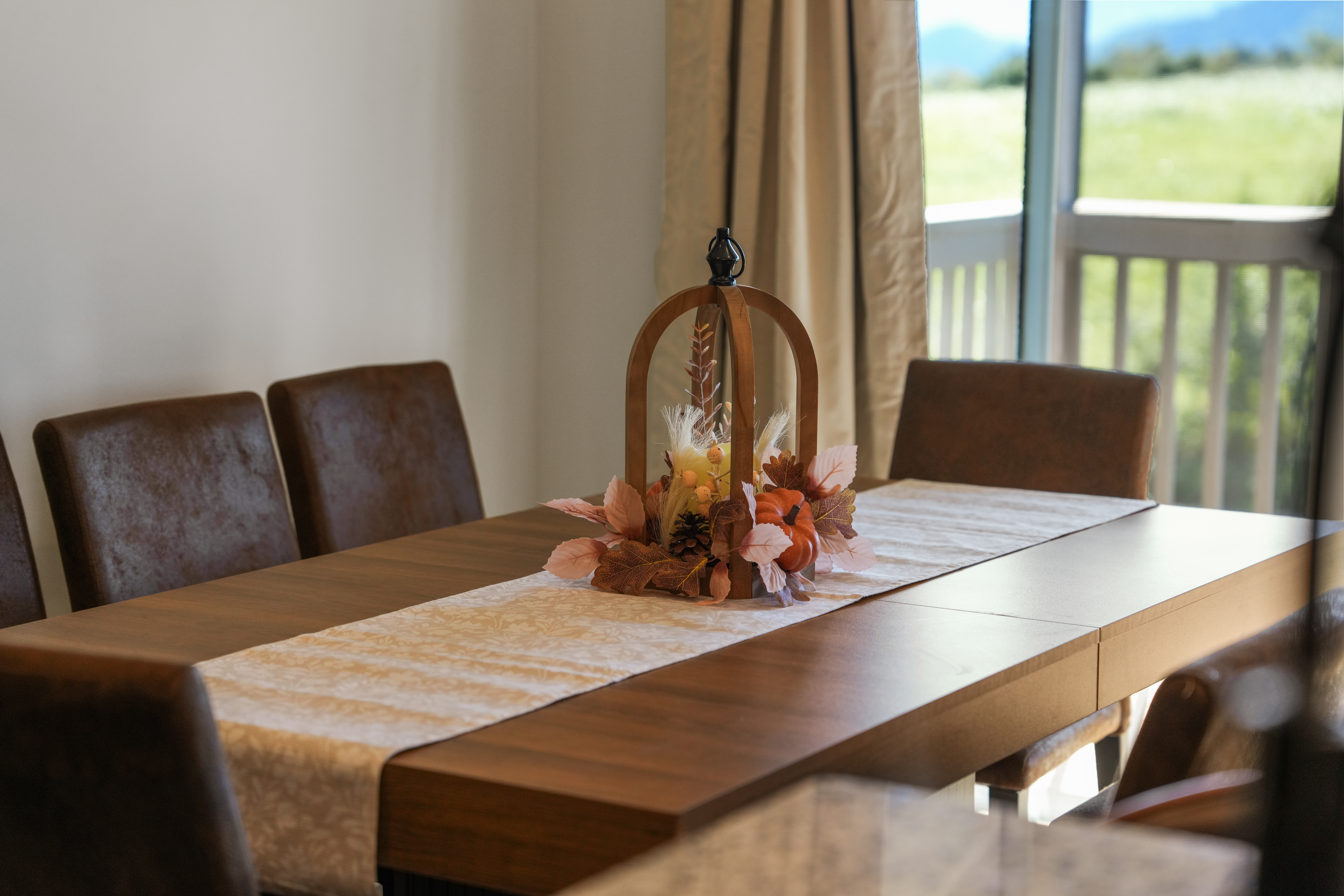 Bright dining space with outdoor views and warm, elegant decor