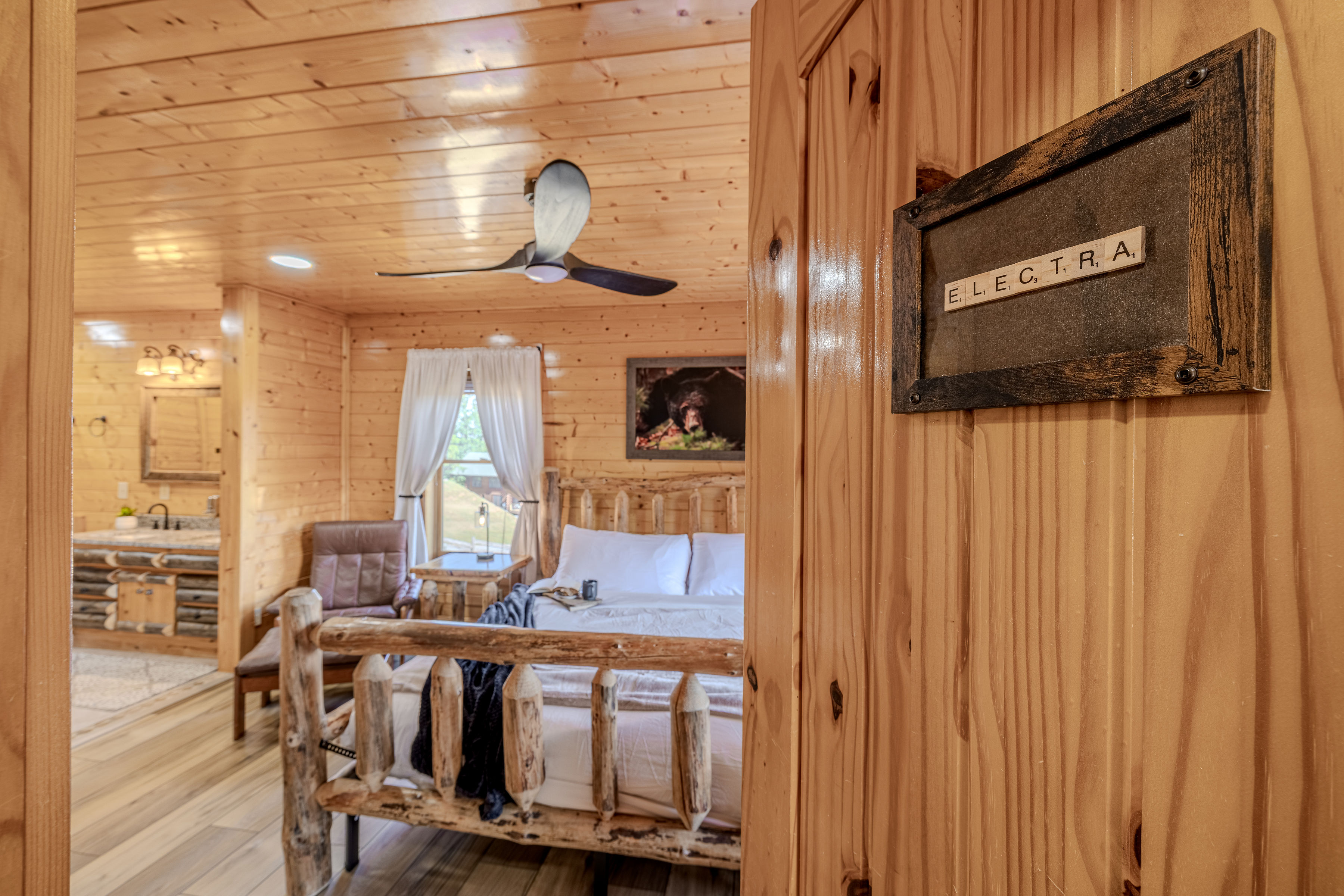 ELECTRA Cozy rustic cabin king suite with log bed, and garden tub, bottom floor left side