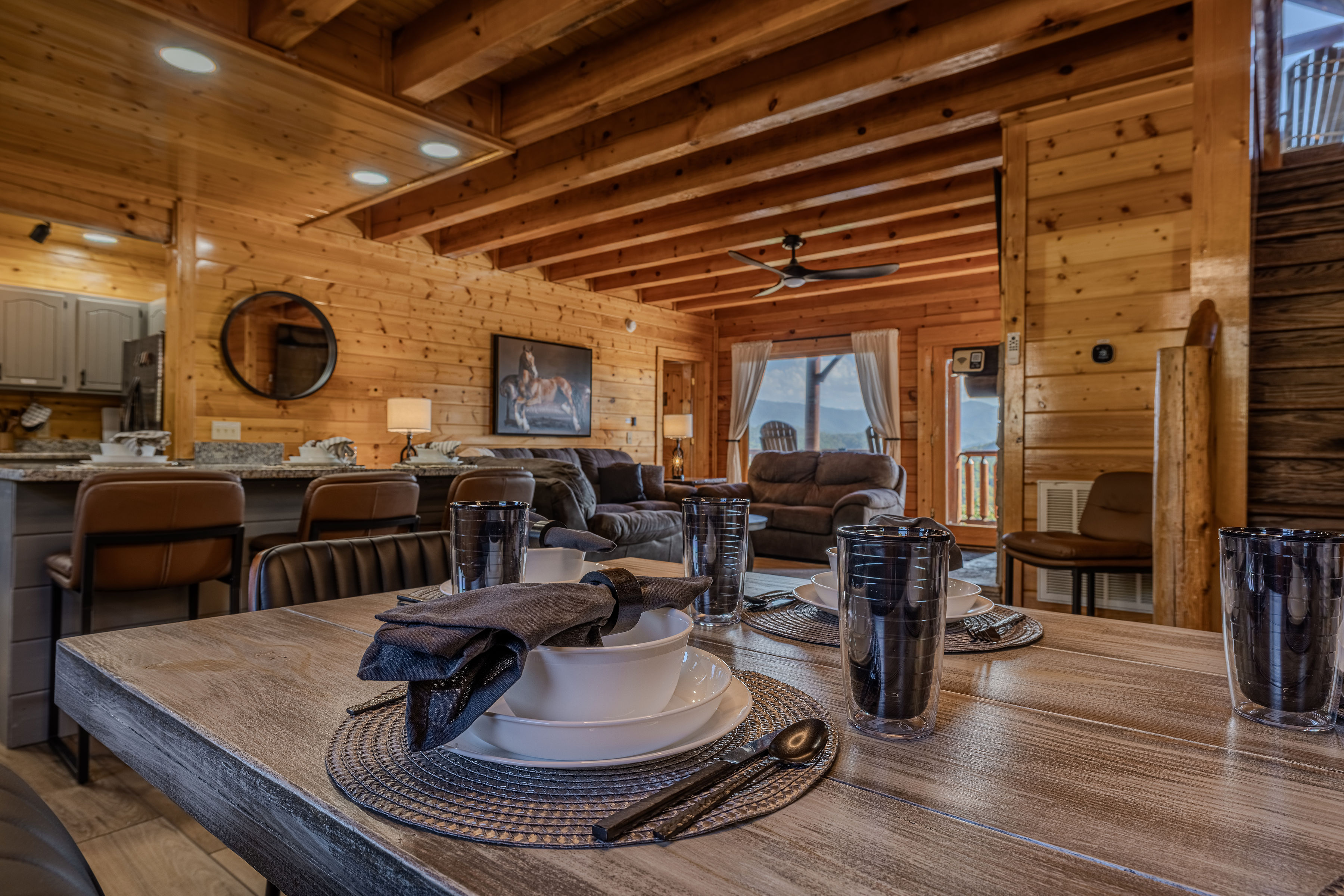 Cozy wood cabin with mountain-view balcony and spacious open living area