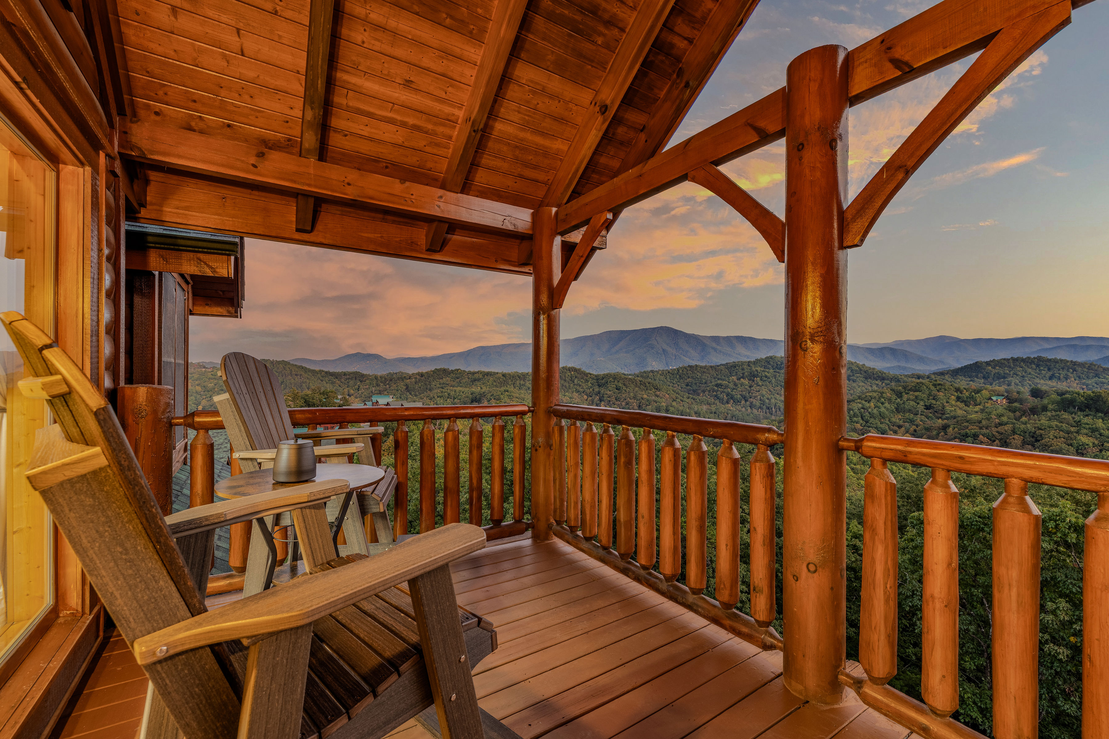 Uppermost mountain-view deck with Poly wood pub chairs at sunset