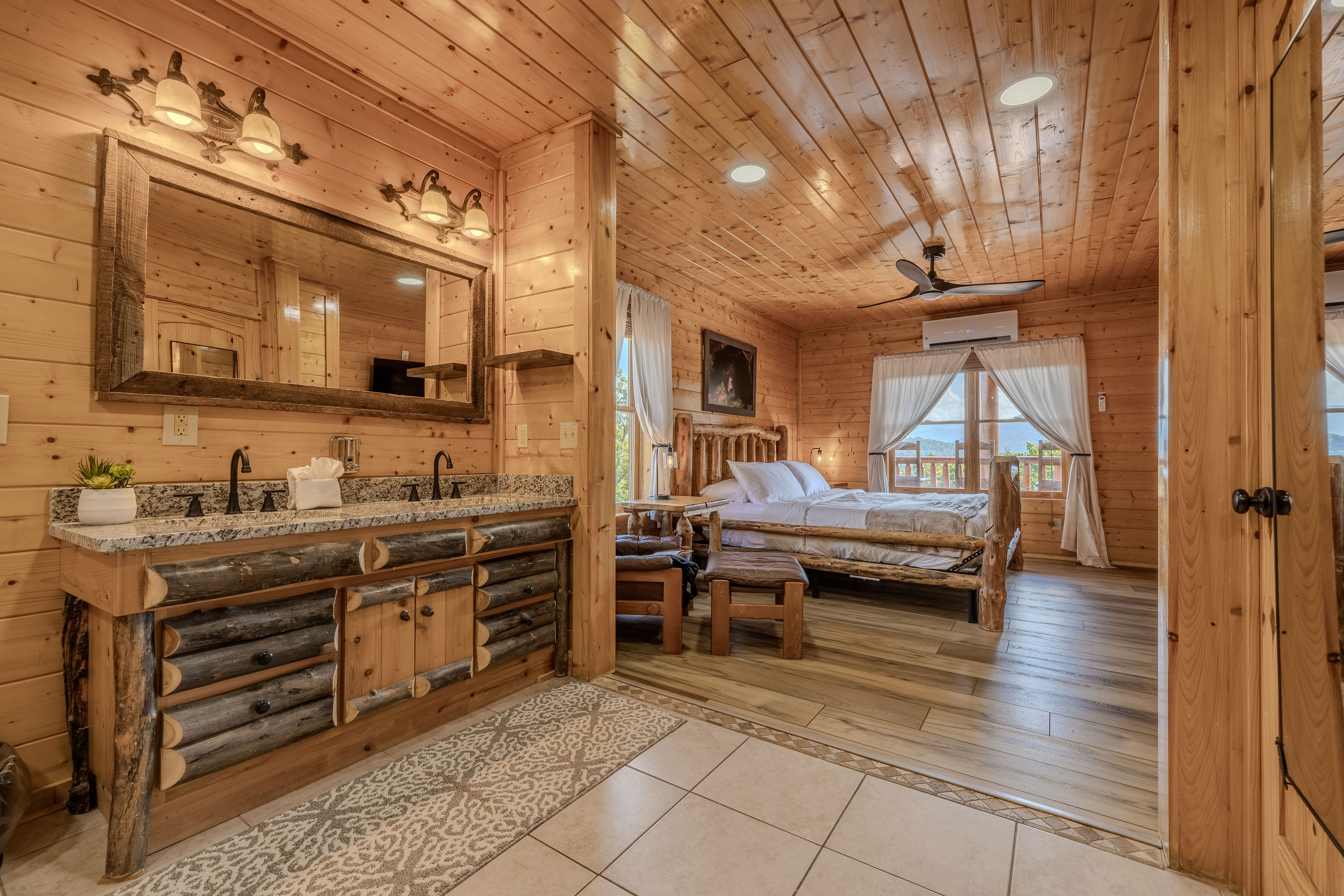 Electra Rustic king suite with log furnishings and double vanity charm granite tops