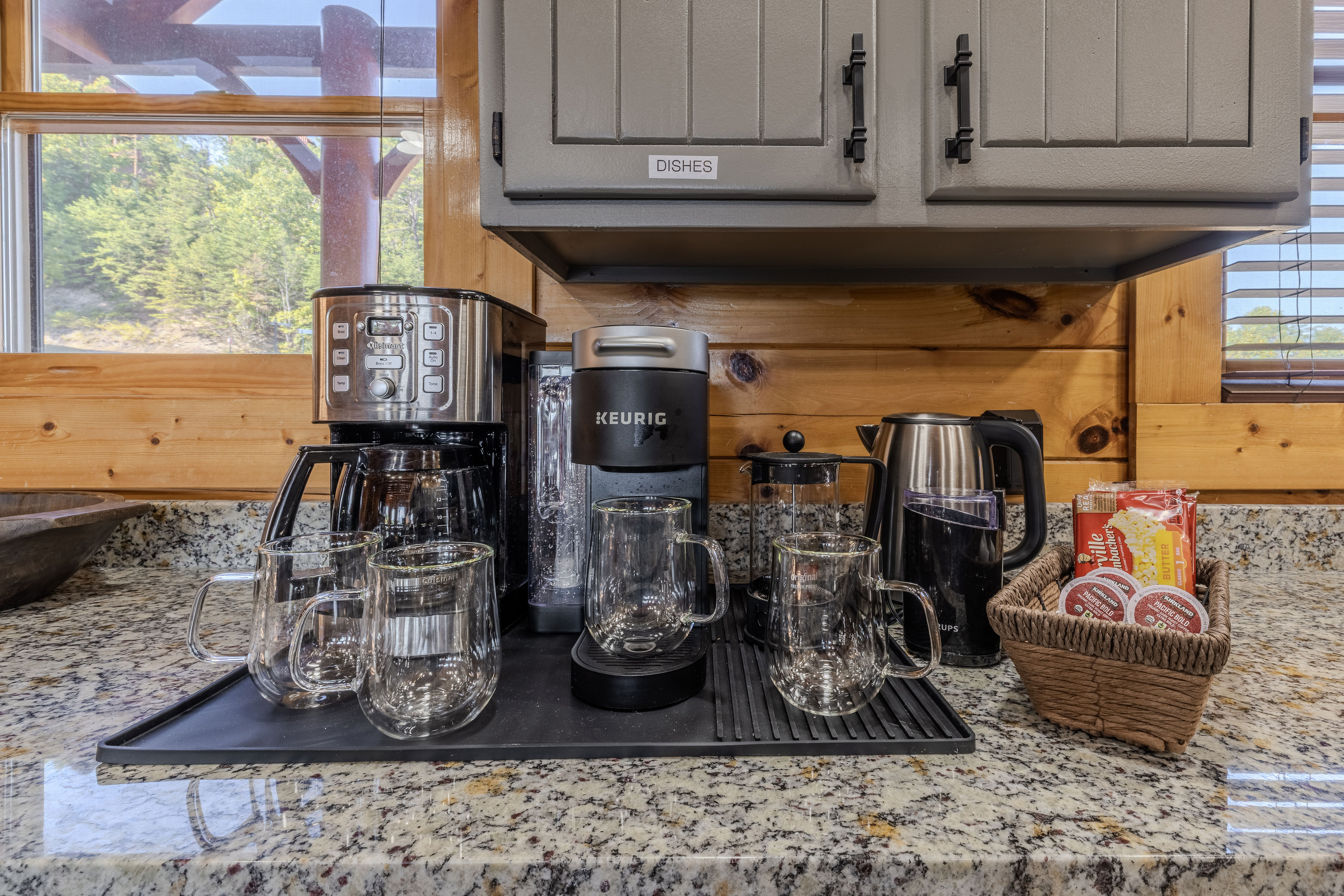 Fully stocked coffee bar with Keurig, drip maker, French press, Tea kettle and cozy cabin charm