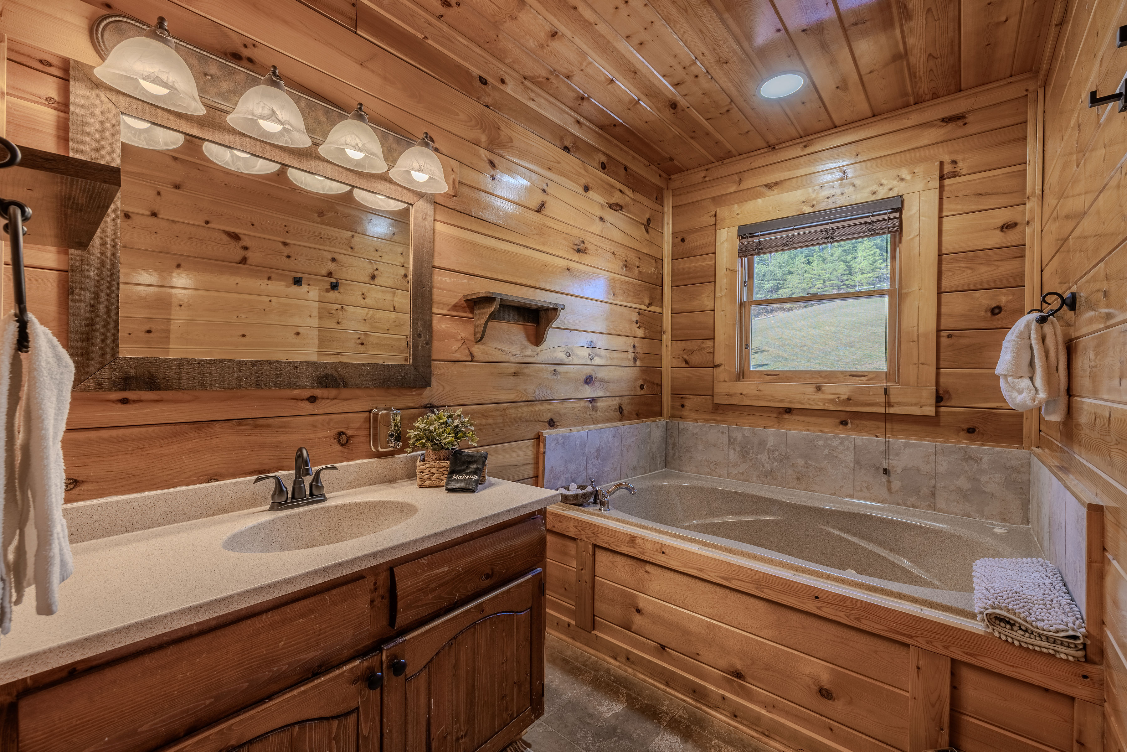 MEROPE Rustic spa-style bath with soaking tub and warm wood cabin charm walk in shower