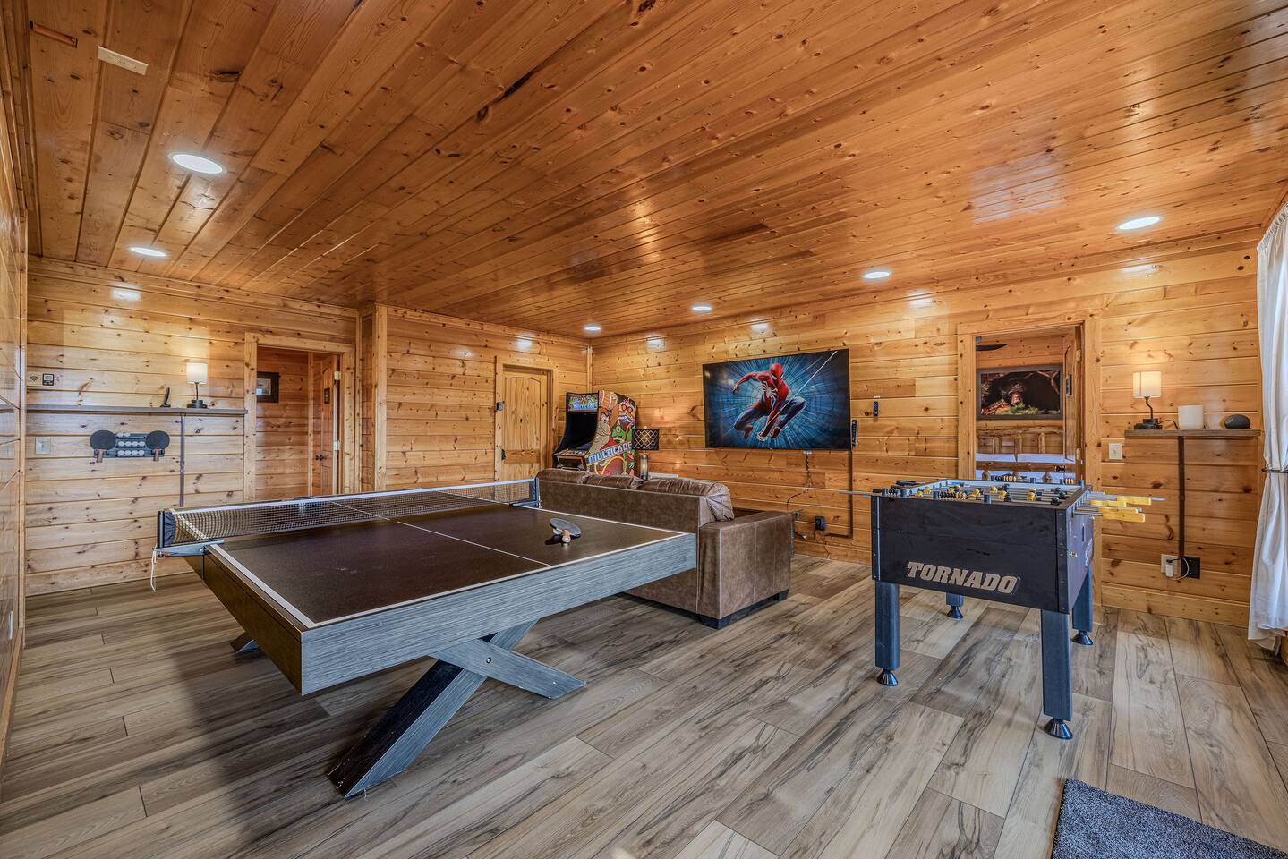 Ping Pong and Foosball Lower Level game room. Half Bath and Laundry on this level