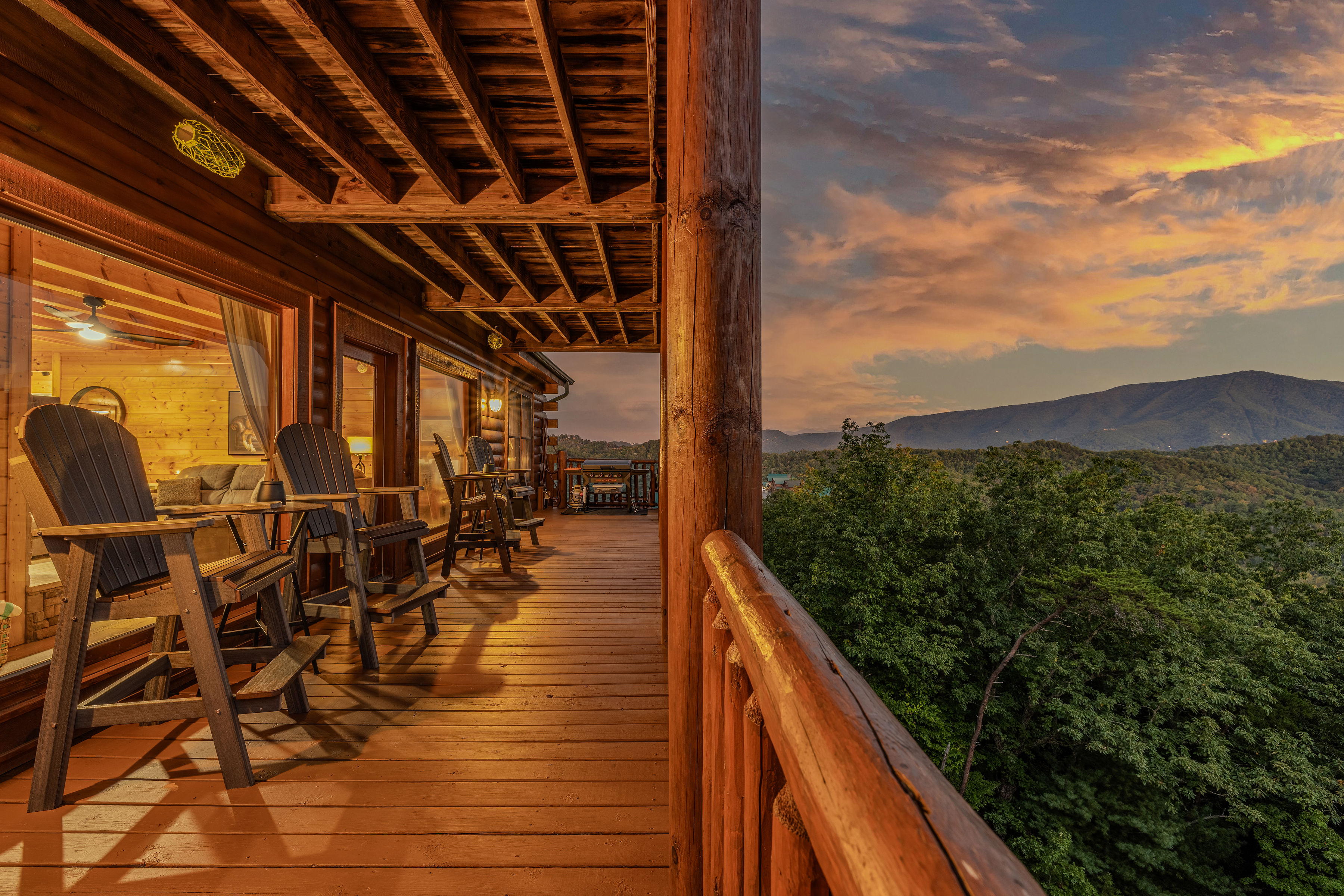 Covered cabin deck with stunning mountain sunset views, middle deck, grill and hot tub
