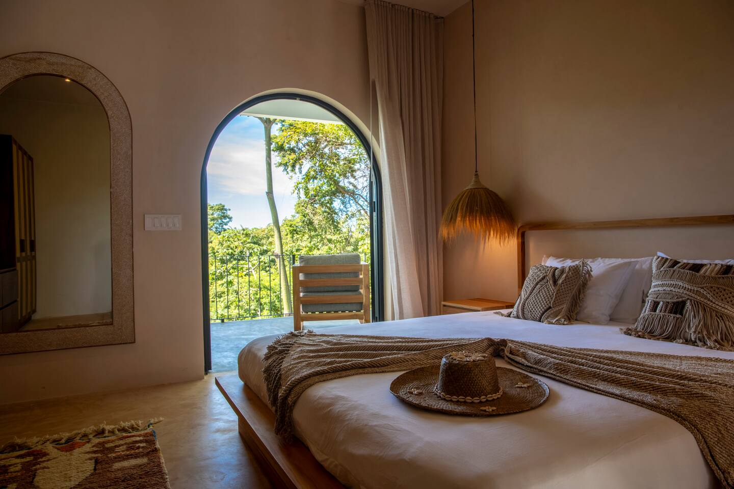 Master Bedroom #1 with King size bed and access to large outdoor balcony with sweeping jungle and ocean views.