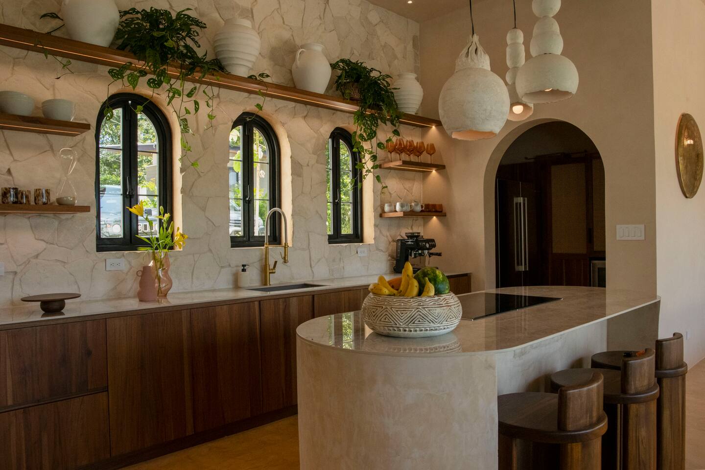 Modern Chef's kitchen with high-end Bosch induction range, oven, dishwasher and refrigerator.