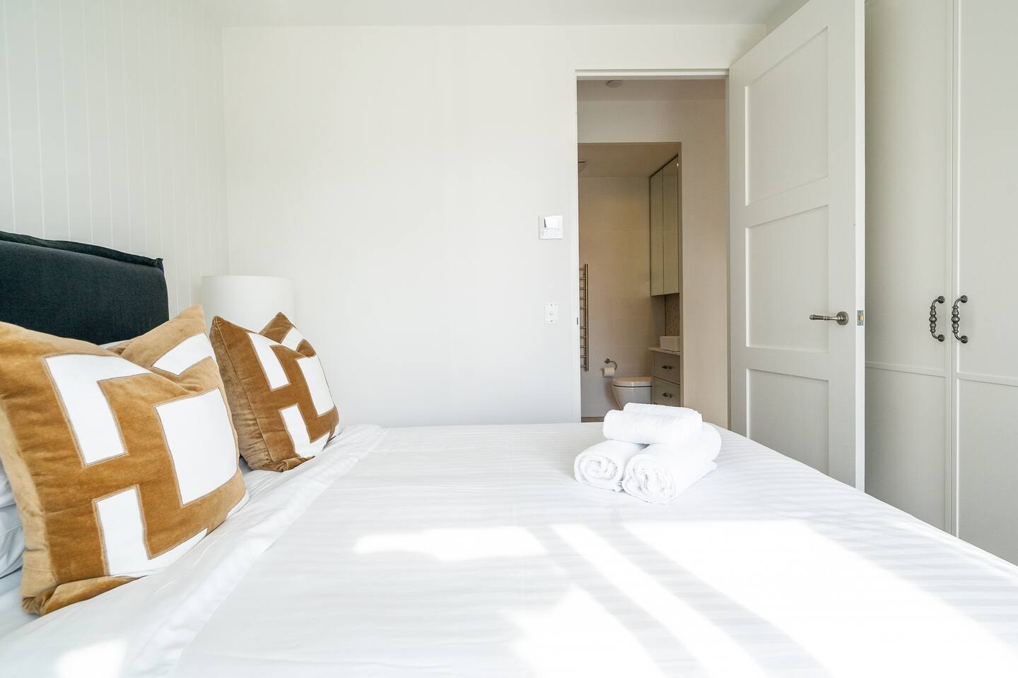 The second bedroom has a queen bed with a north facing balcony.