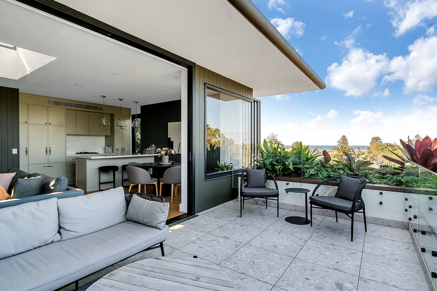 Generous sized balcony with lounge and table seating