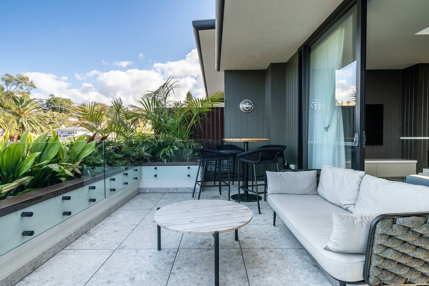 Large balcony with plenty of outdoor seating.