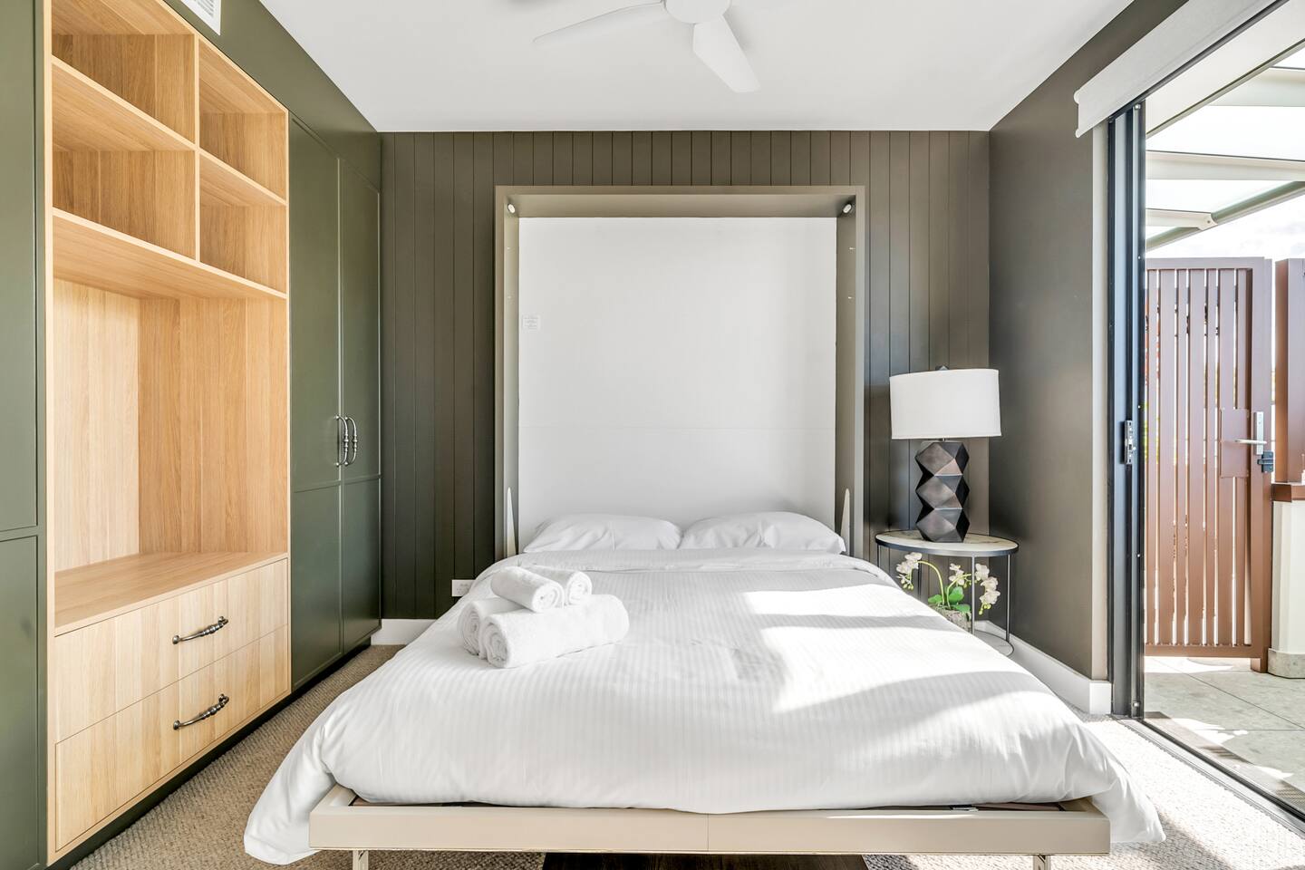 3rd bedroom with Clei Italian Wall bed that folds up and has a desk underneath.