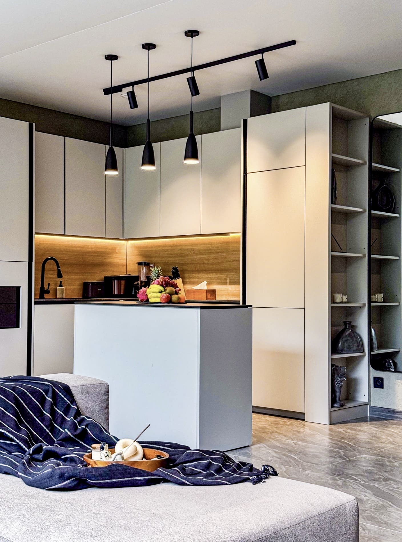 Stylish modern kitchen with island, warm lighting, and open-plan comfort