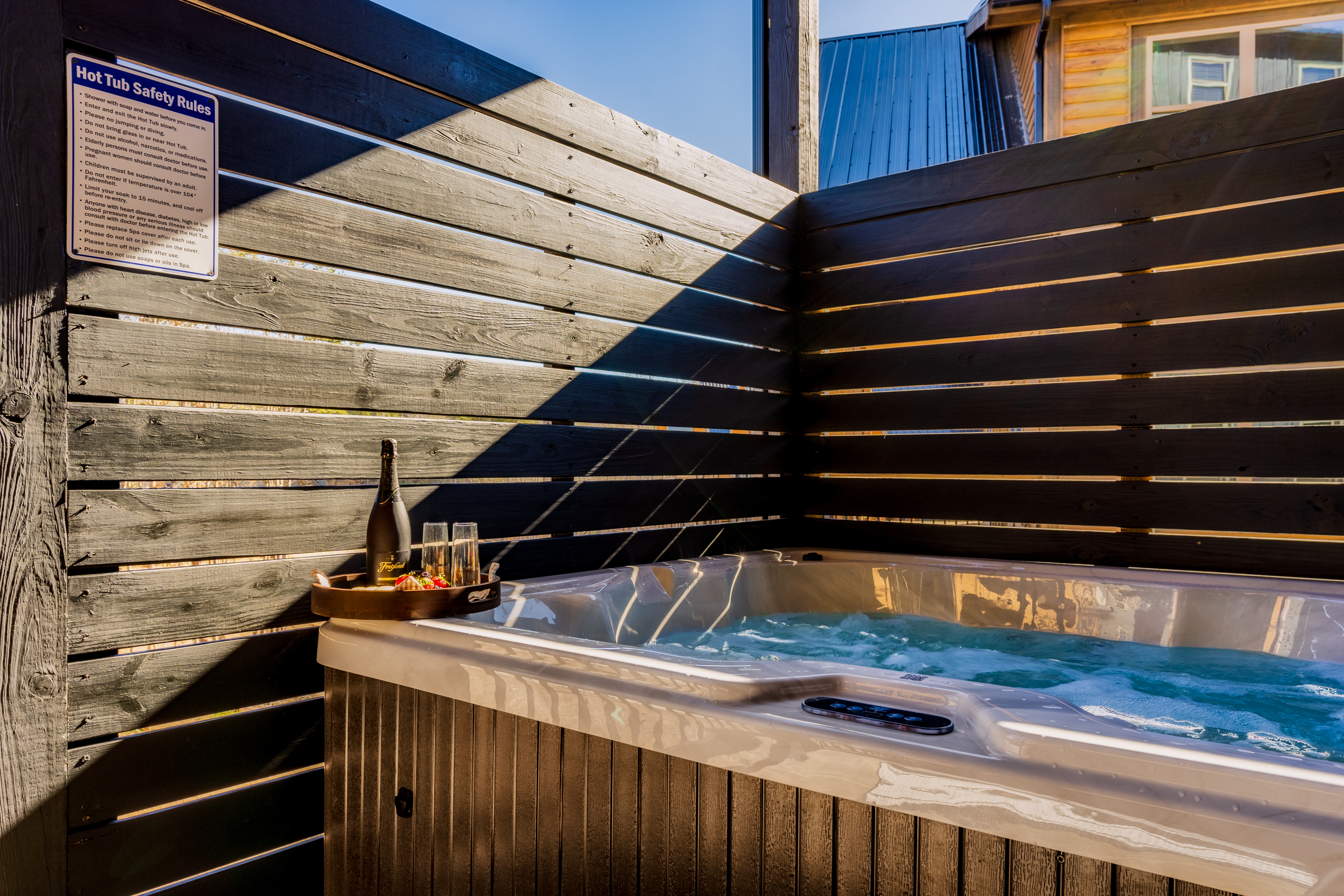 Private outdoor hot tub with cozy spa setup and fenced seclusion