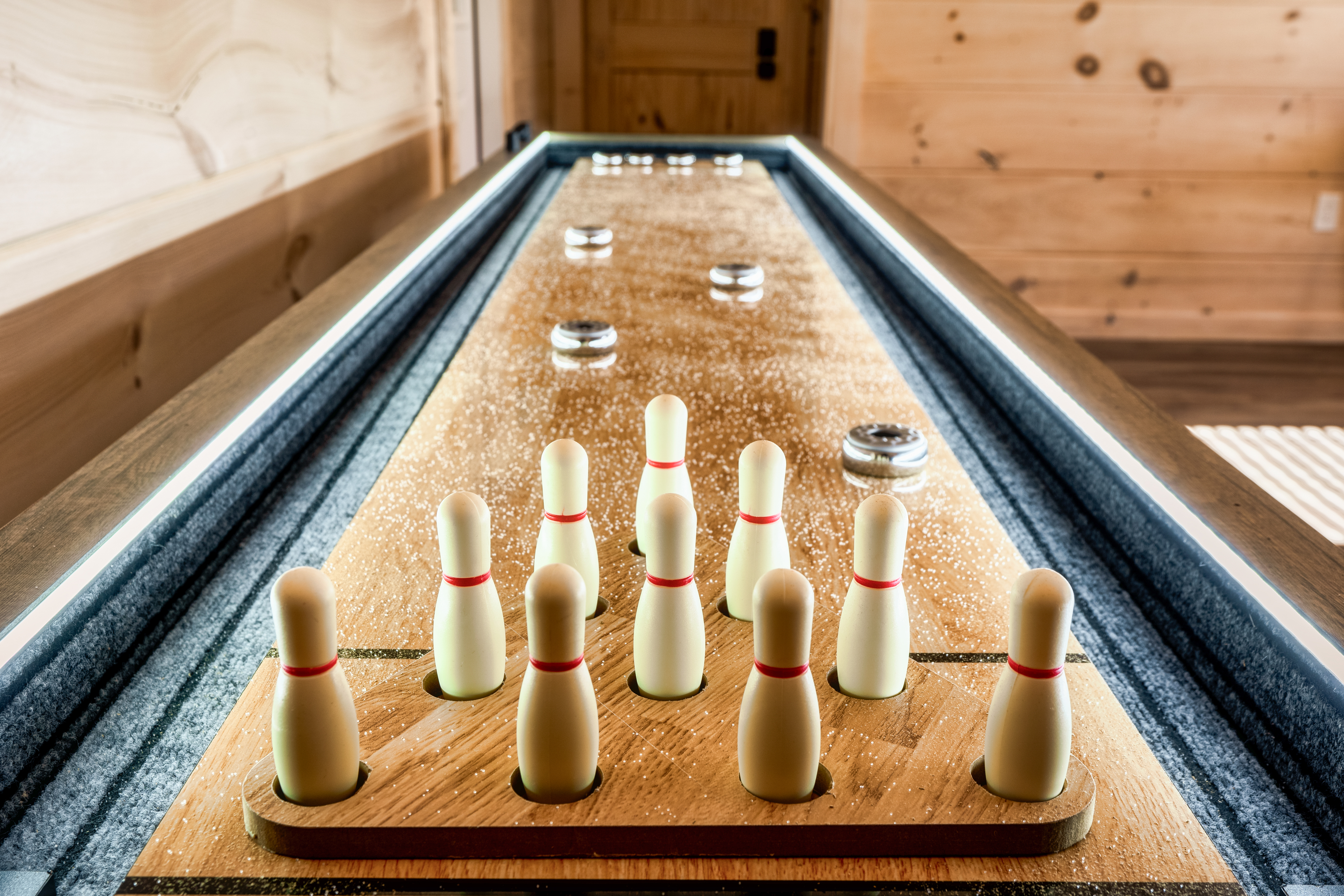 Cozy game room with stylish shuffleboard for indoor fun