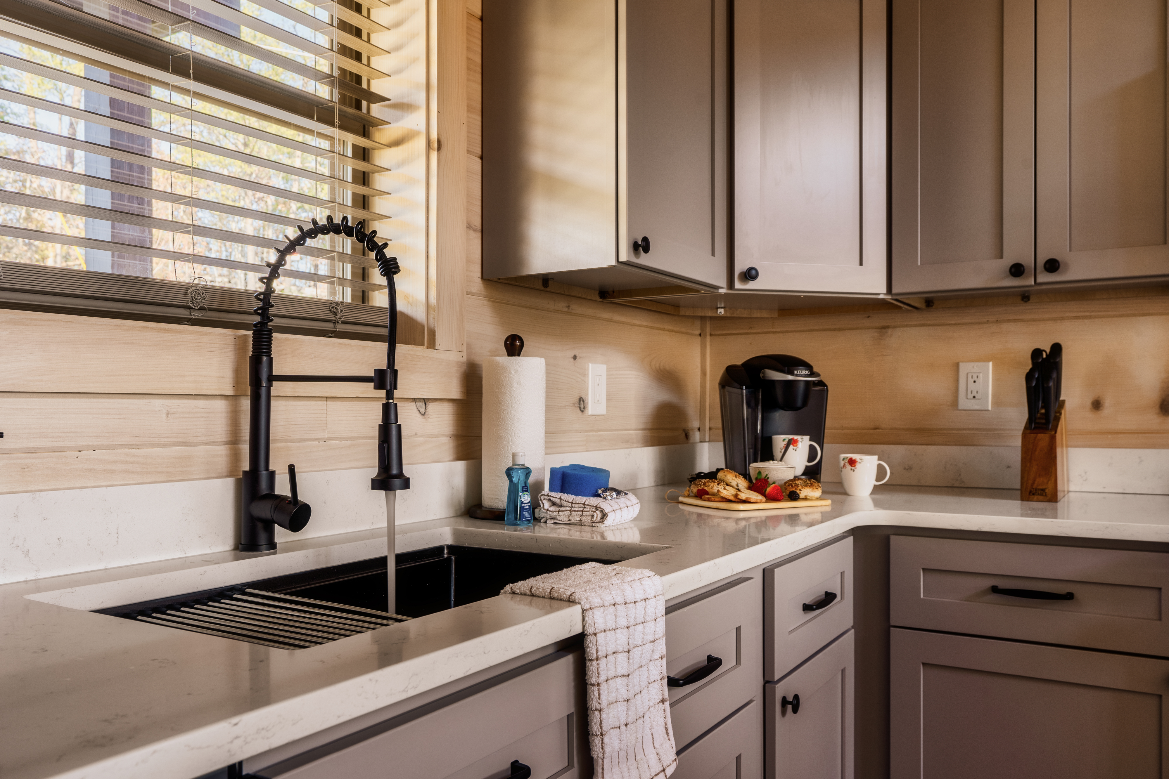 Cozy modern kitchen with coffee station and farmhouse sink