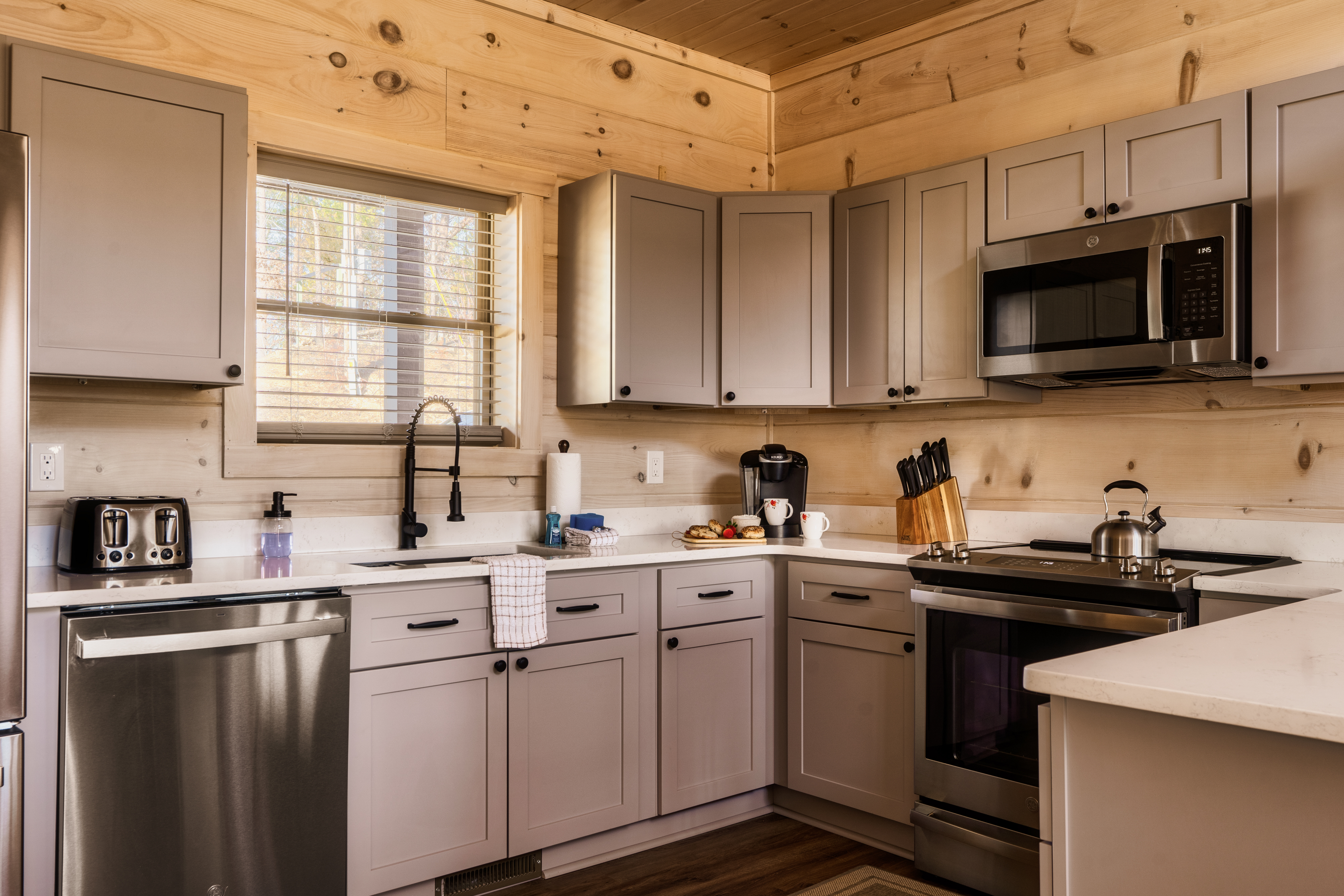 Rustic-modern kitchen with stainless appliances and warm wood charm