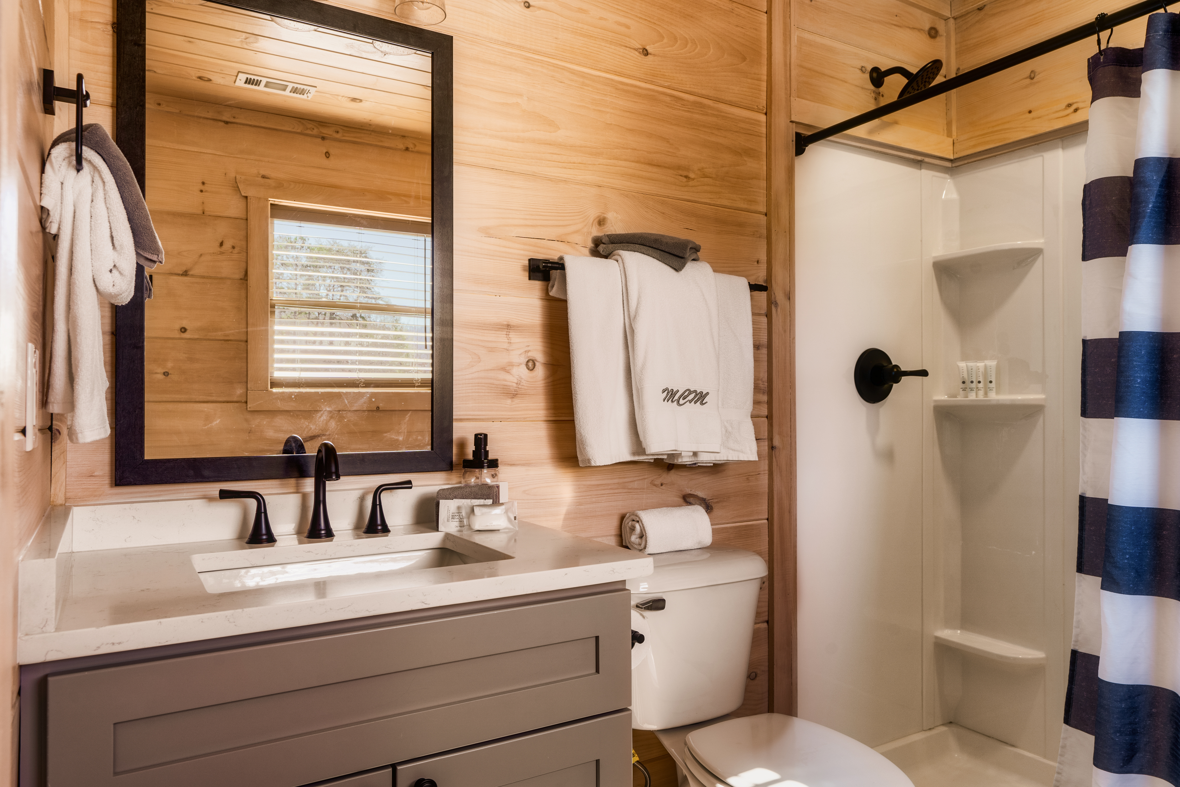 Cozy wood-accent bathroom with modern vanity and walk-in shower