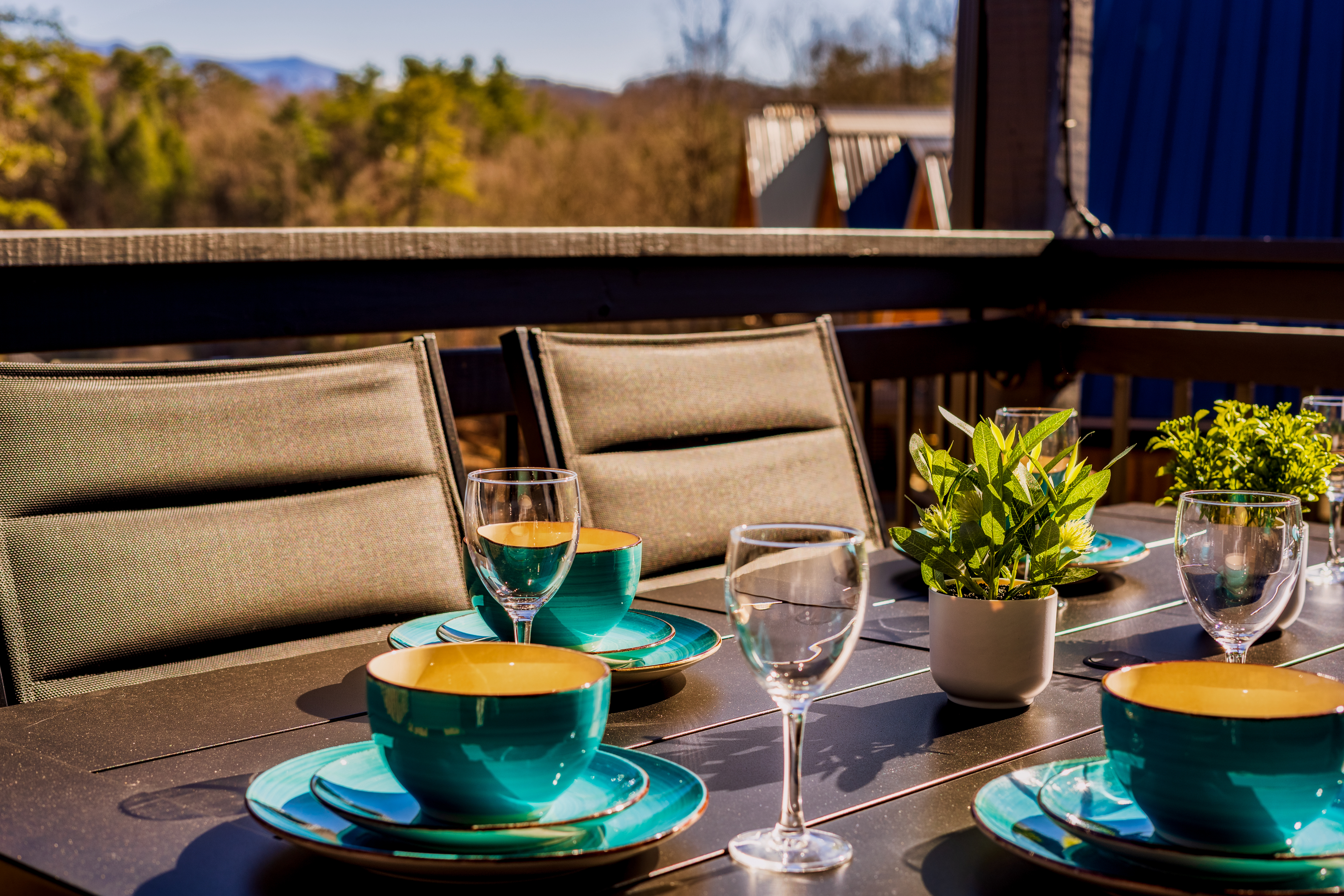 Sunny deck dining with mountain views and stylish outdoor seating