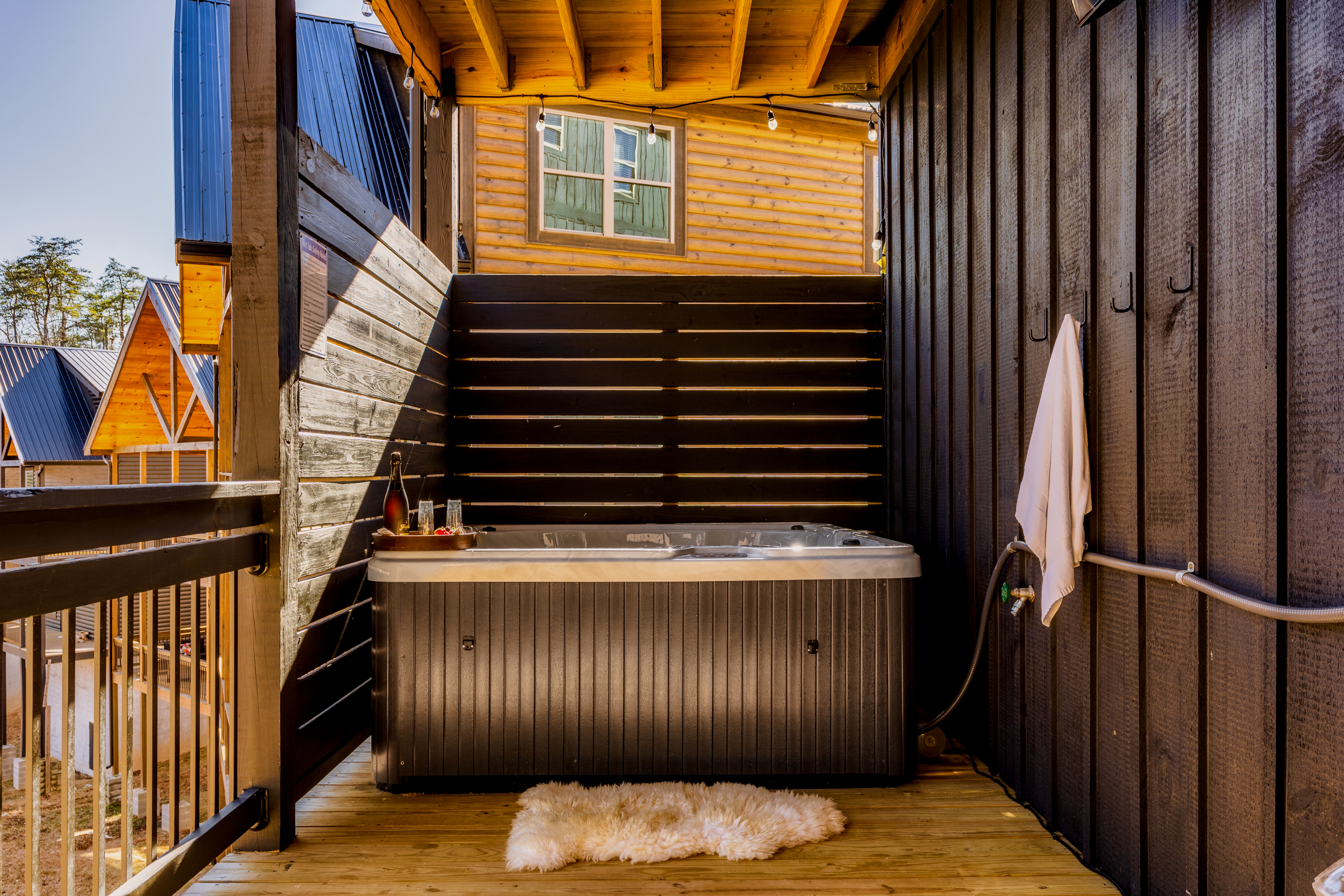 Private covered hot tub deck with cozy lodge-style charm