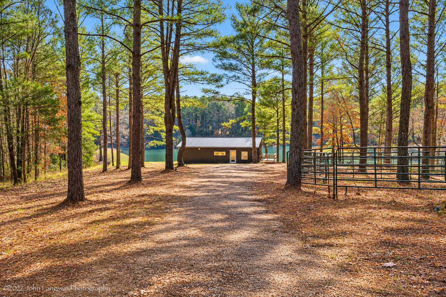 Private lakefront retreat framed by towering pines and peaceful views