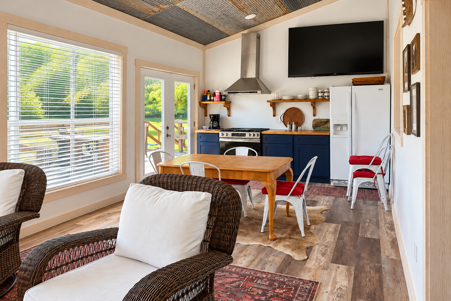 Bright rustic kitchen-lounge with big windows, TV, and outdoor views