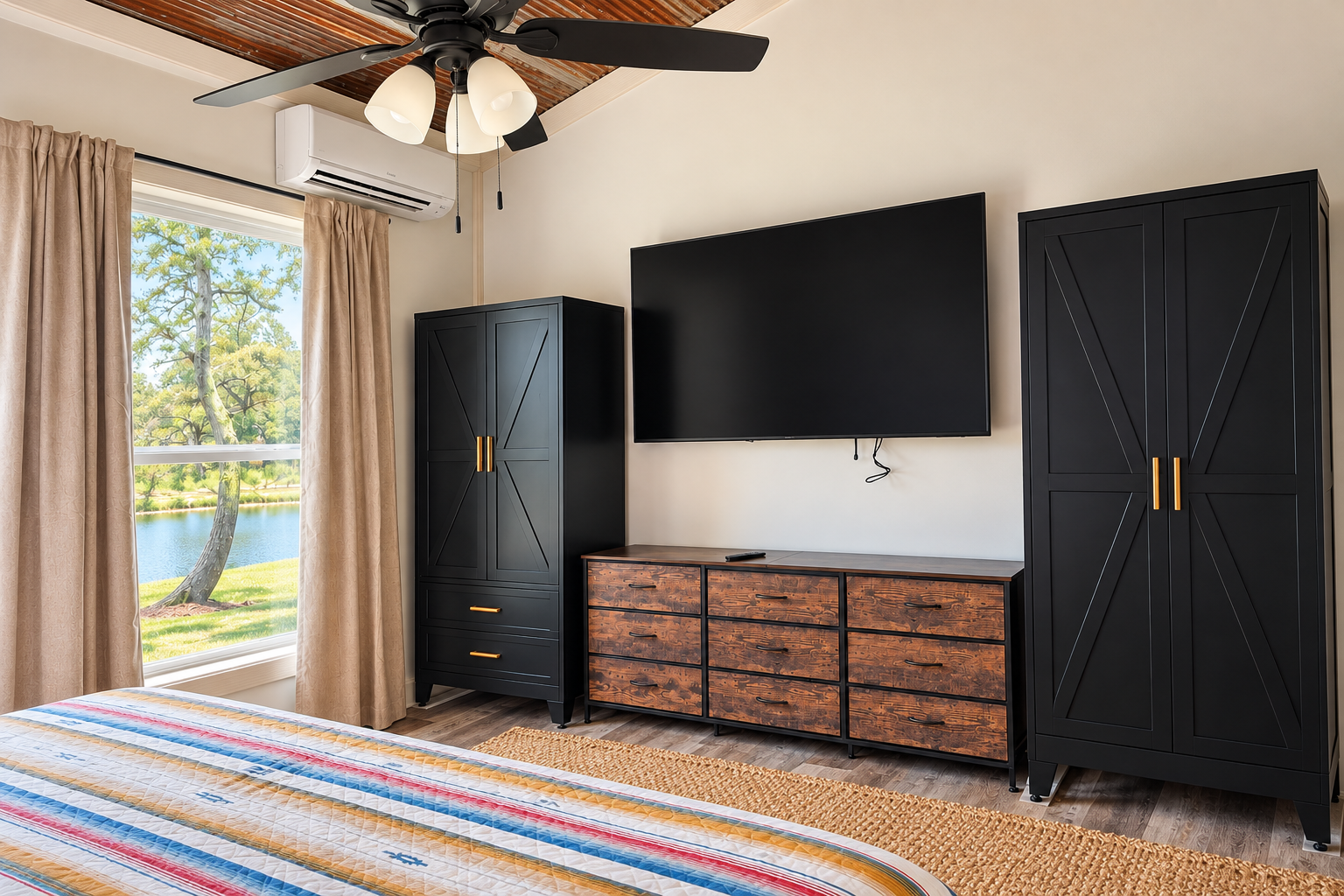 Bright bedroom with TV, ample storage, and serene water views