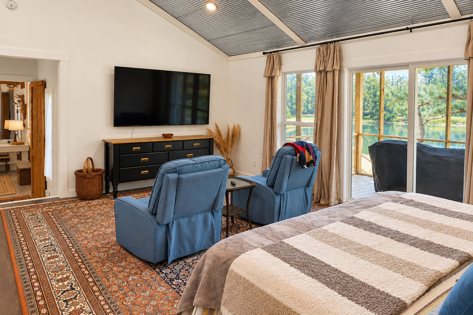 Lakeview bedroom with private deck, TV, and cozy sitting area