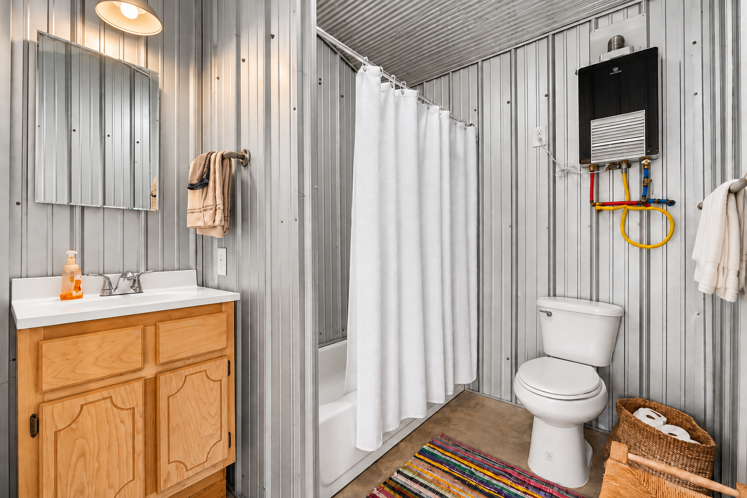 Rustic industrial bathroom with tub-shower and warm wood vanity