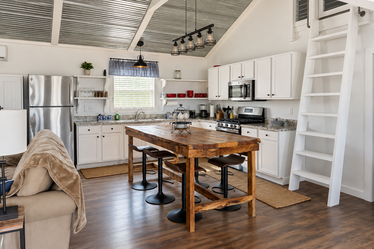 Bright farmhouse-style kitchen with rustic island and loft charm