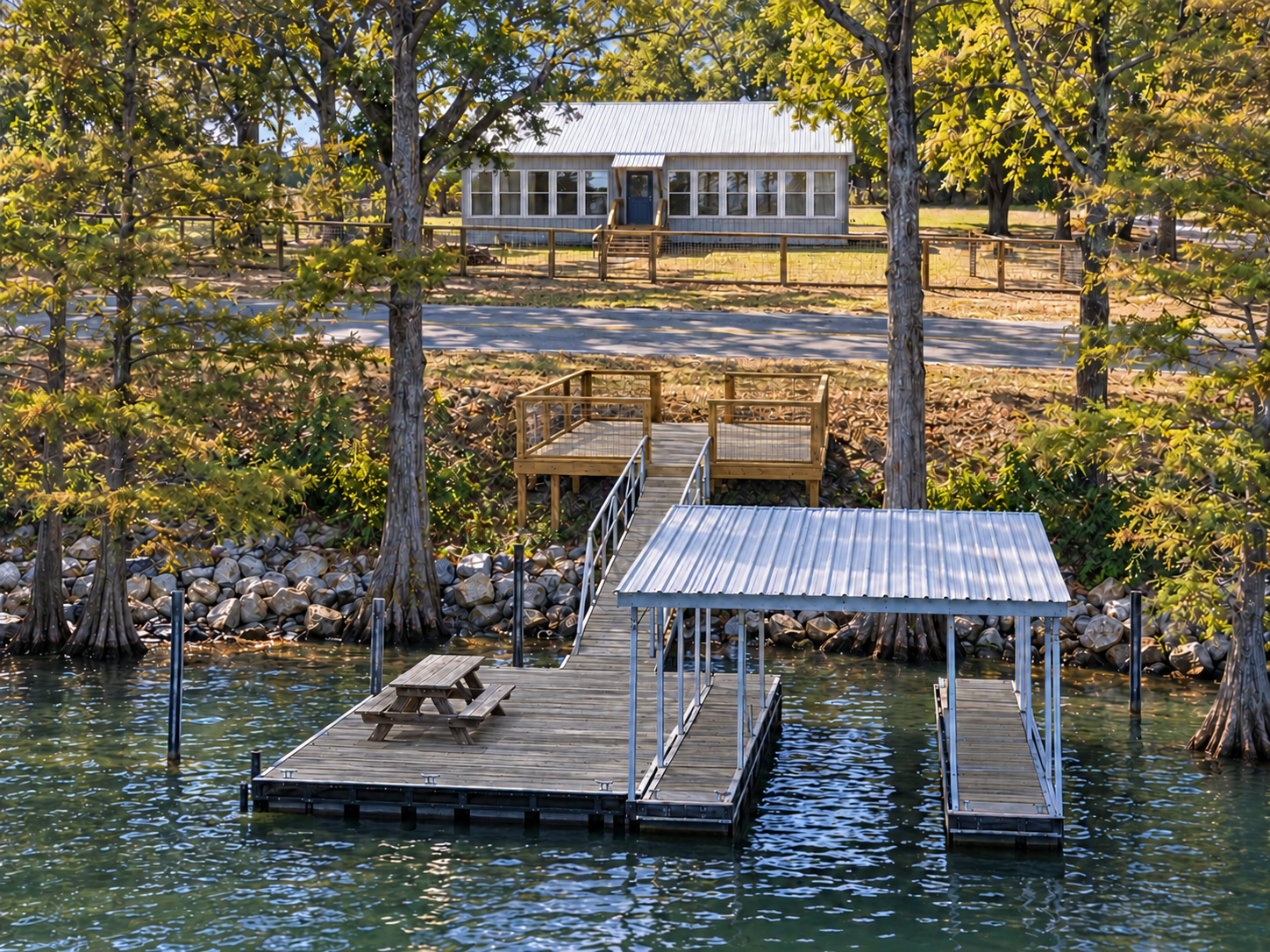 Private lake dock with covered boat slip and peaceful waterfront views