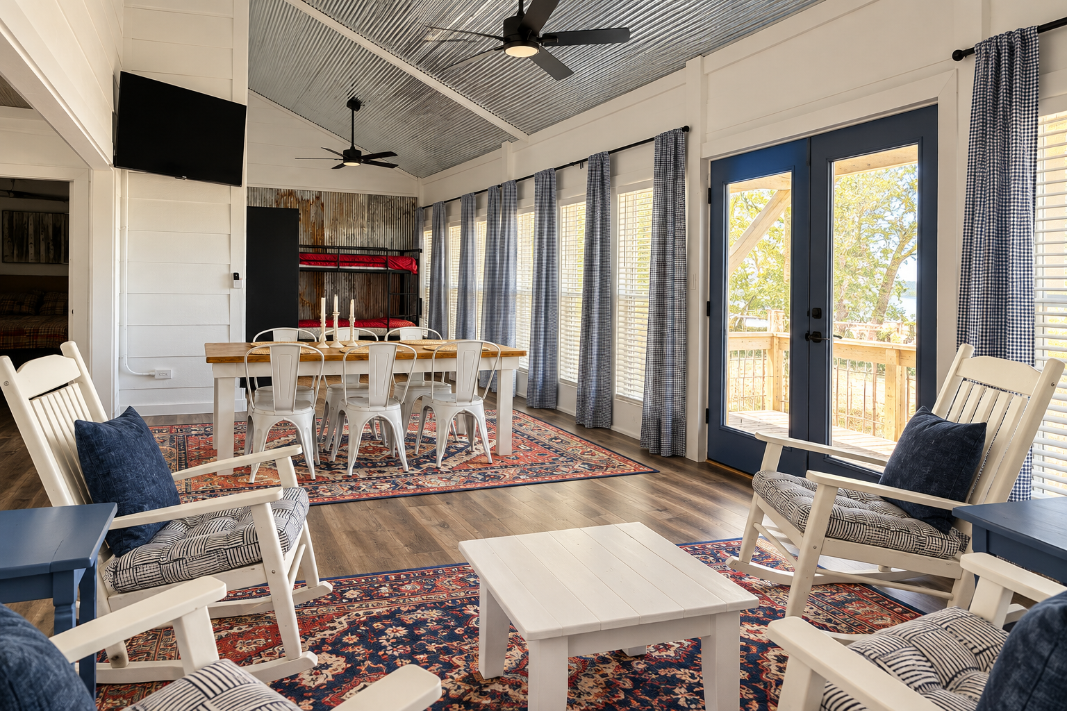 Bright open-concept lounge with farmhouse dining and deck access