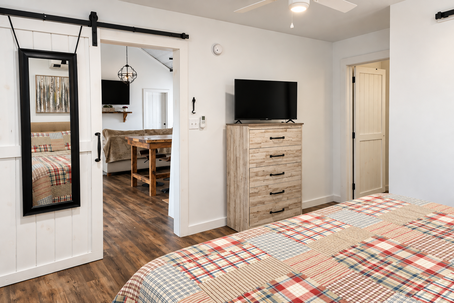 Cozy farmhouse-style bedroom with TV and open-concept layout