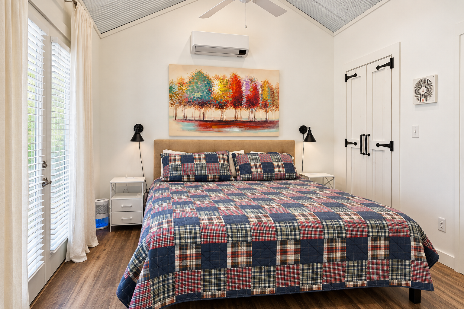 Bright vaulted bedroom with king bed, natural light, and cozy charm