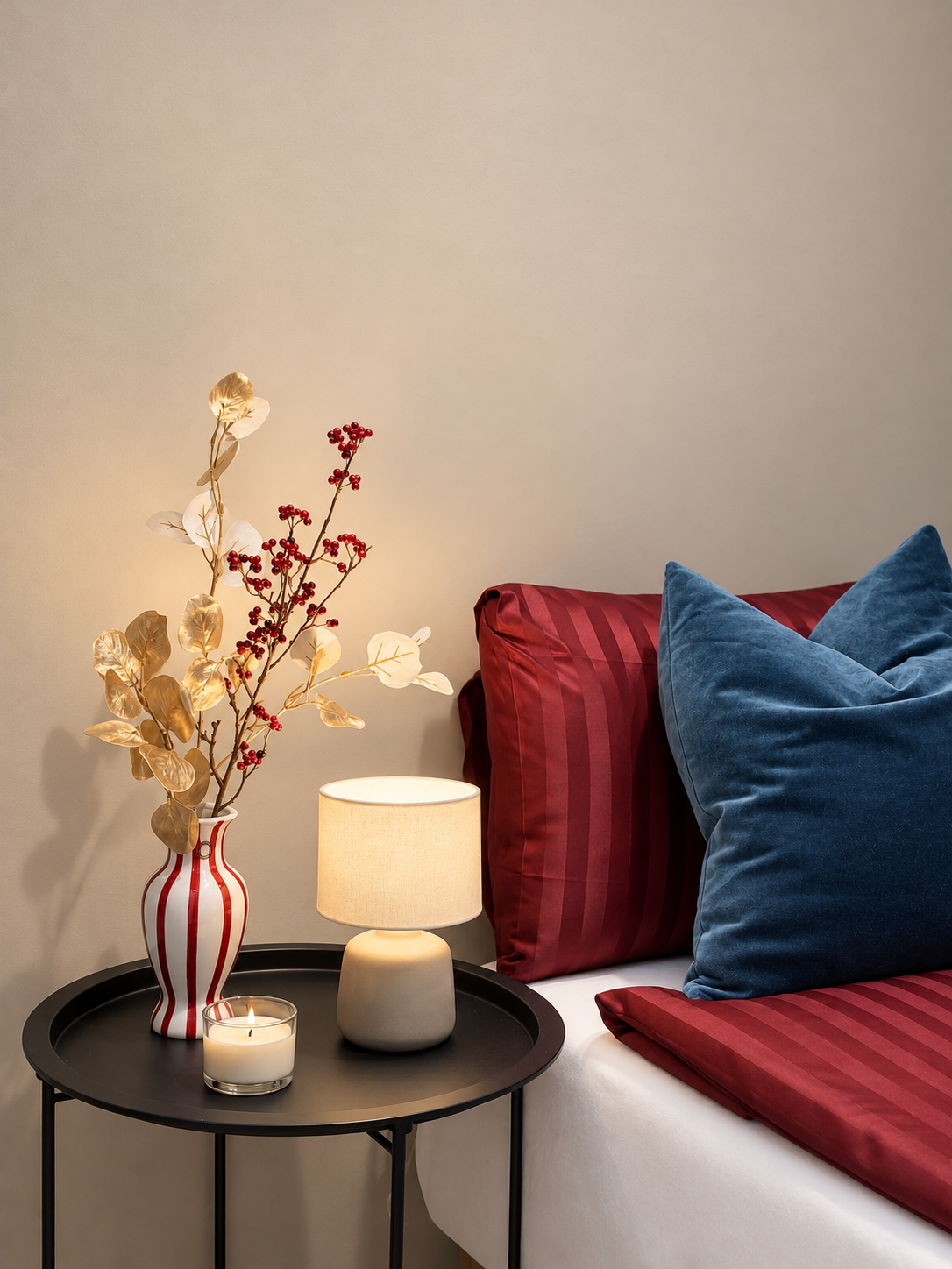 Cozy bedside styling with warm lighting and rich, elegant accents