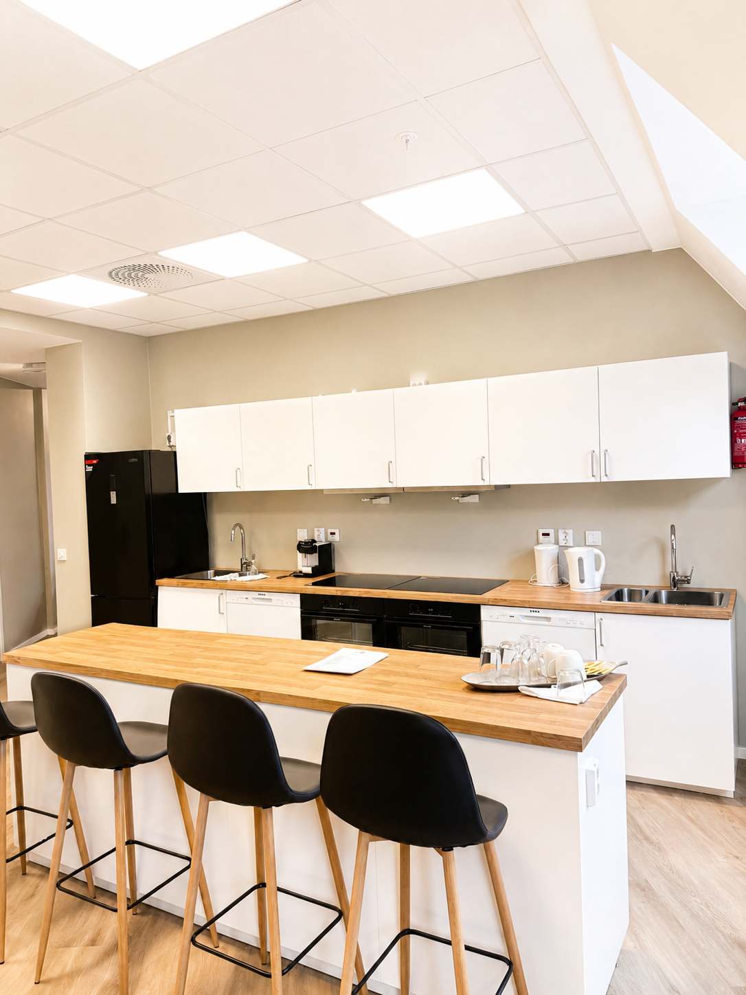Bright modern kitchen with island seating and full cooking essentials