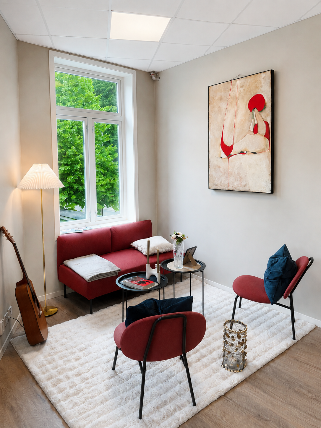Bright, stylish lounge nook with large window and cozy modern seating