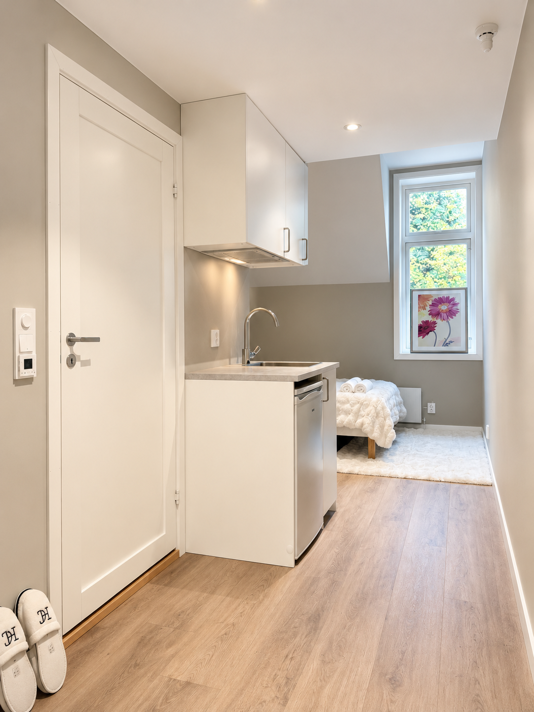 Bright modern studio with kitchenette and cozy sleeping nook