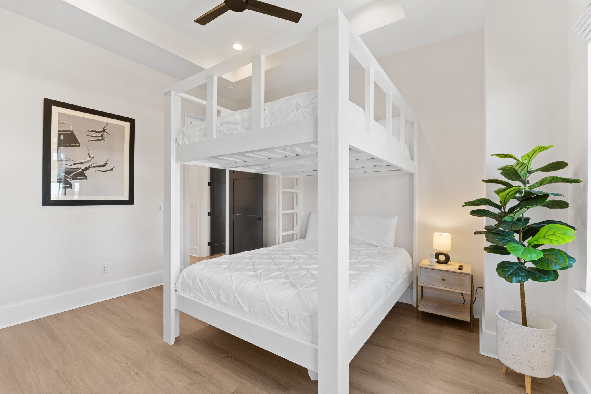 Bright modern bunk room with high ceilings, stylish design, and family-friendly sleep space
