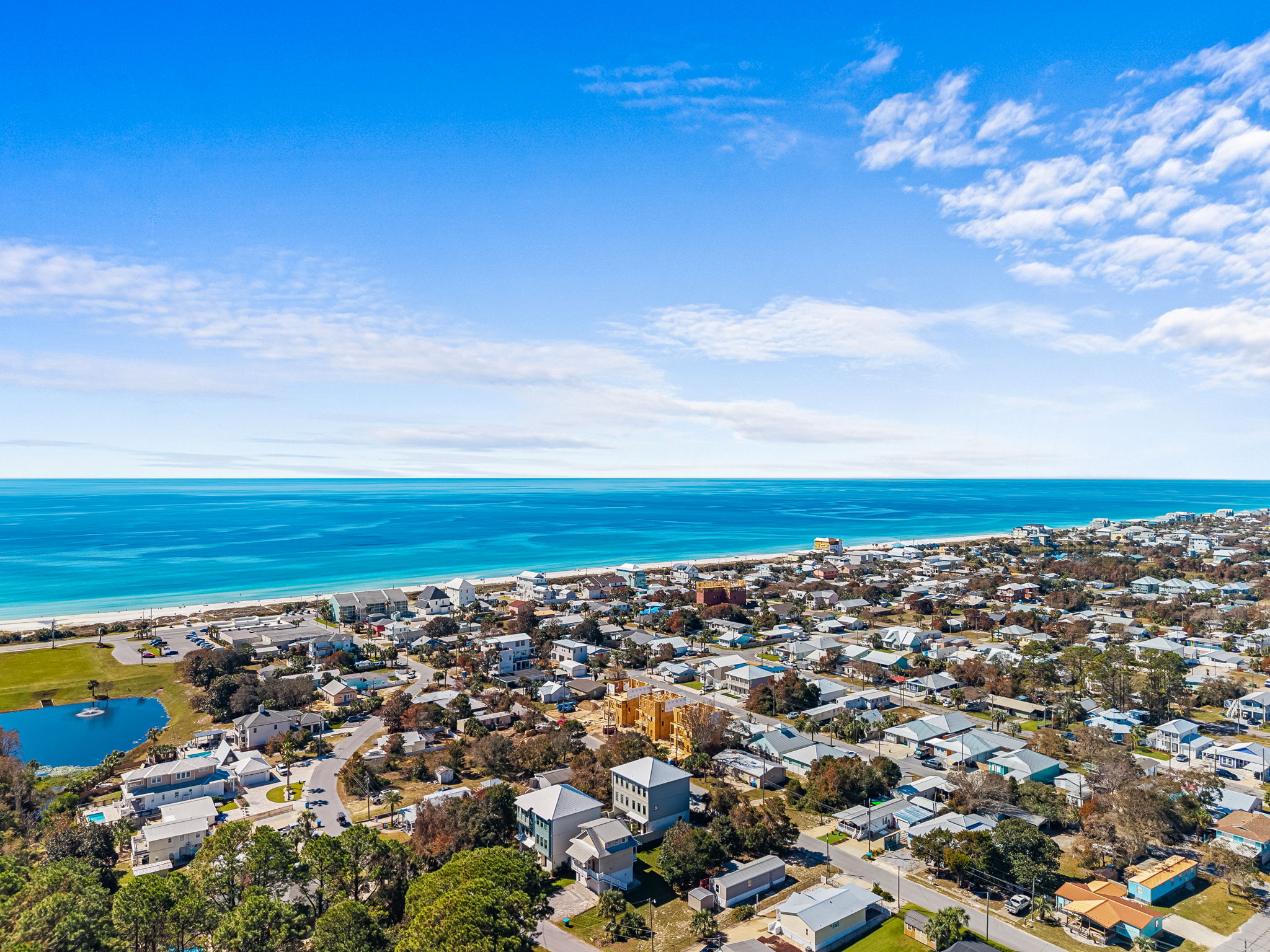 Aerial coastal views with beach access and turquoise Gulf waters