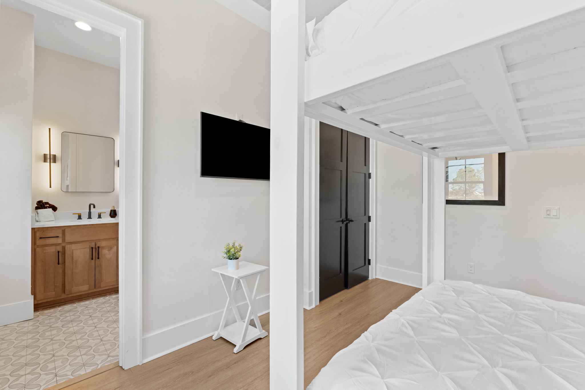 Bright bunk-style bedroom with en suite bath and modern finishes