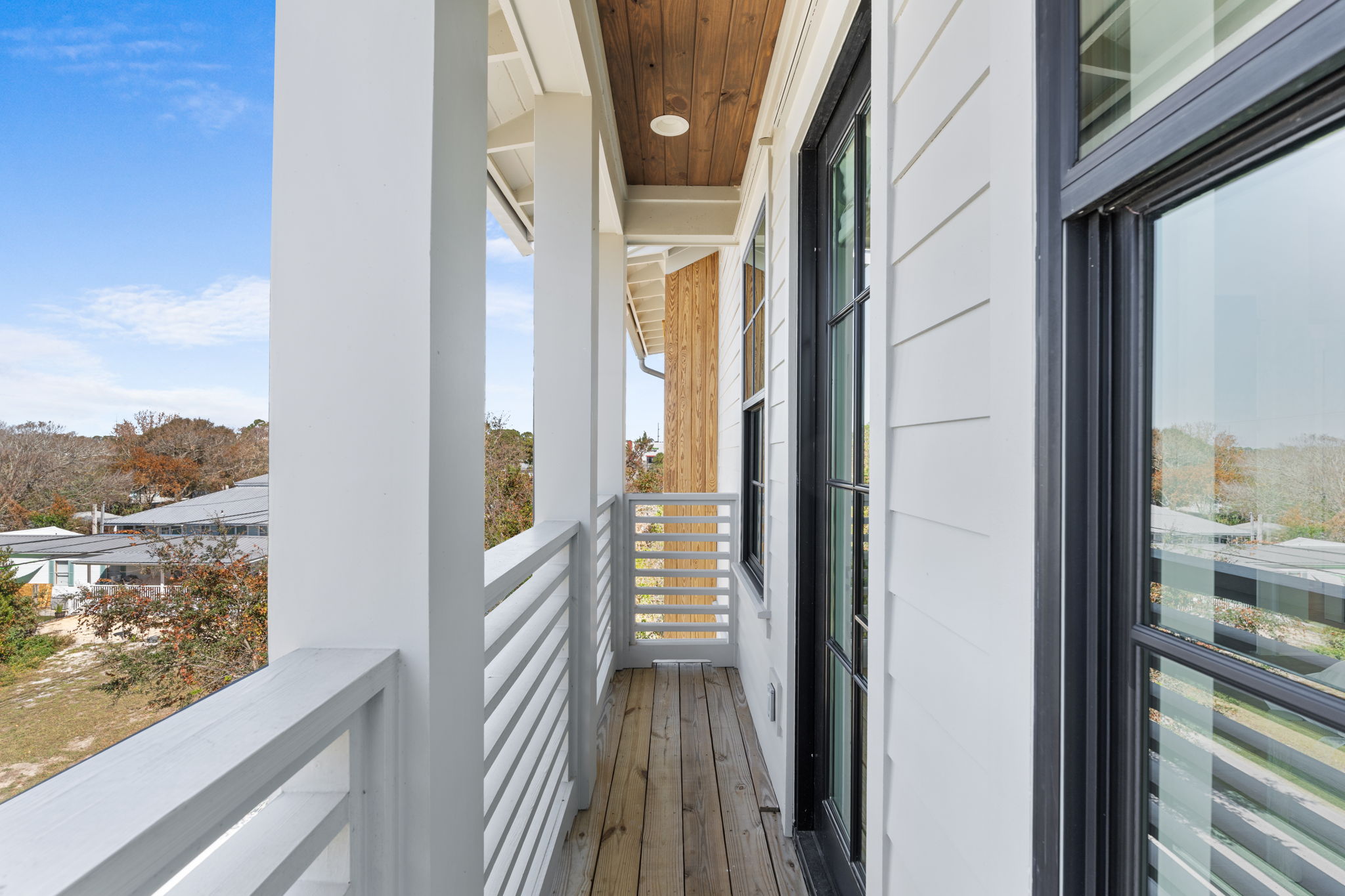 Private upper balcony with modern finishes and neighborhood views