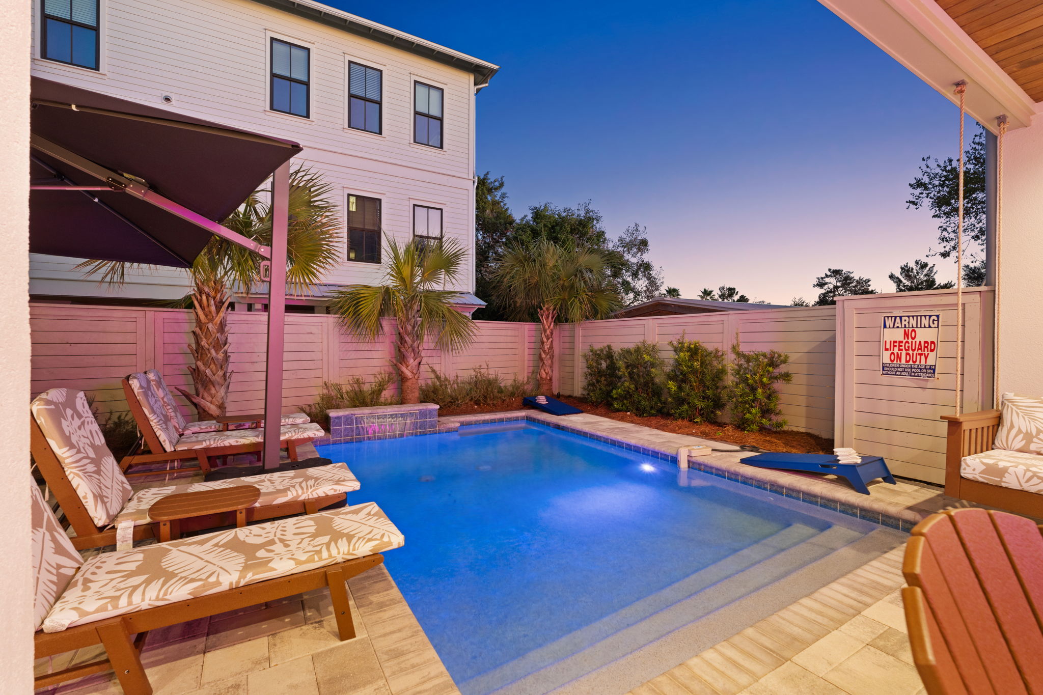 Private plunge pool with loungers and tropical backyard vibes