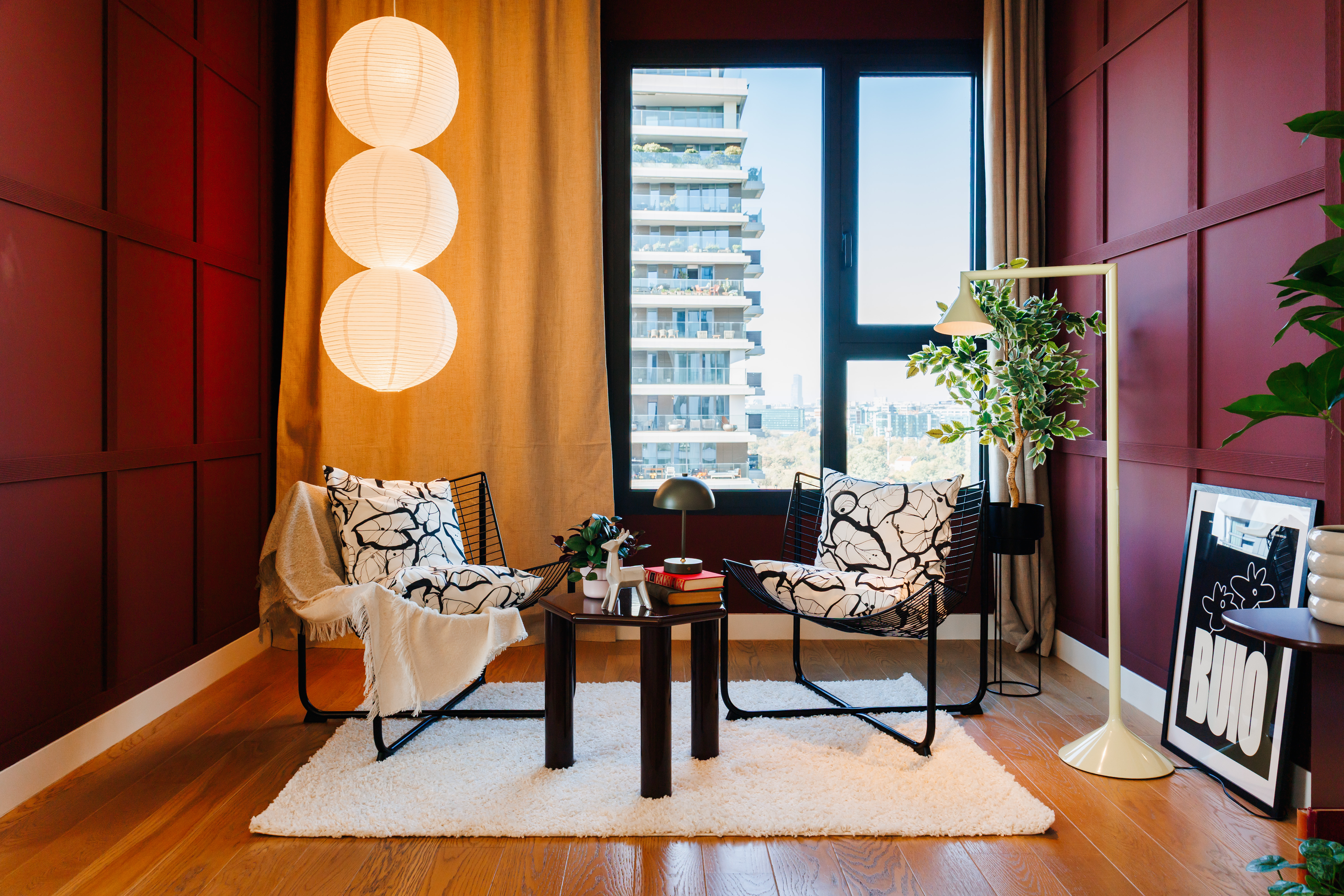 Chic city-view lounge nook with designer touches and cozy seating