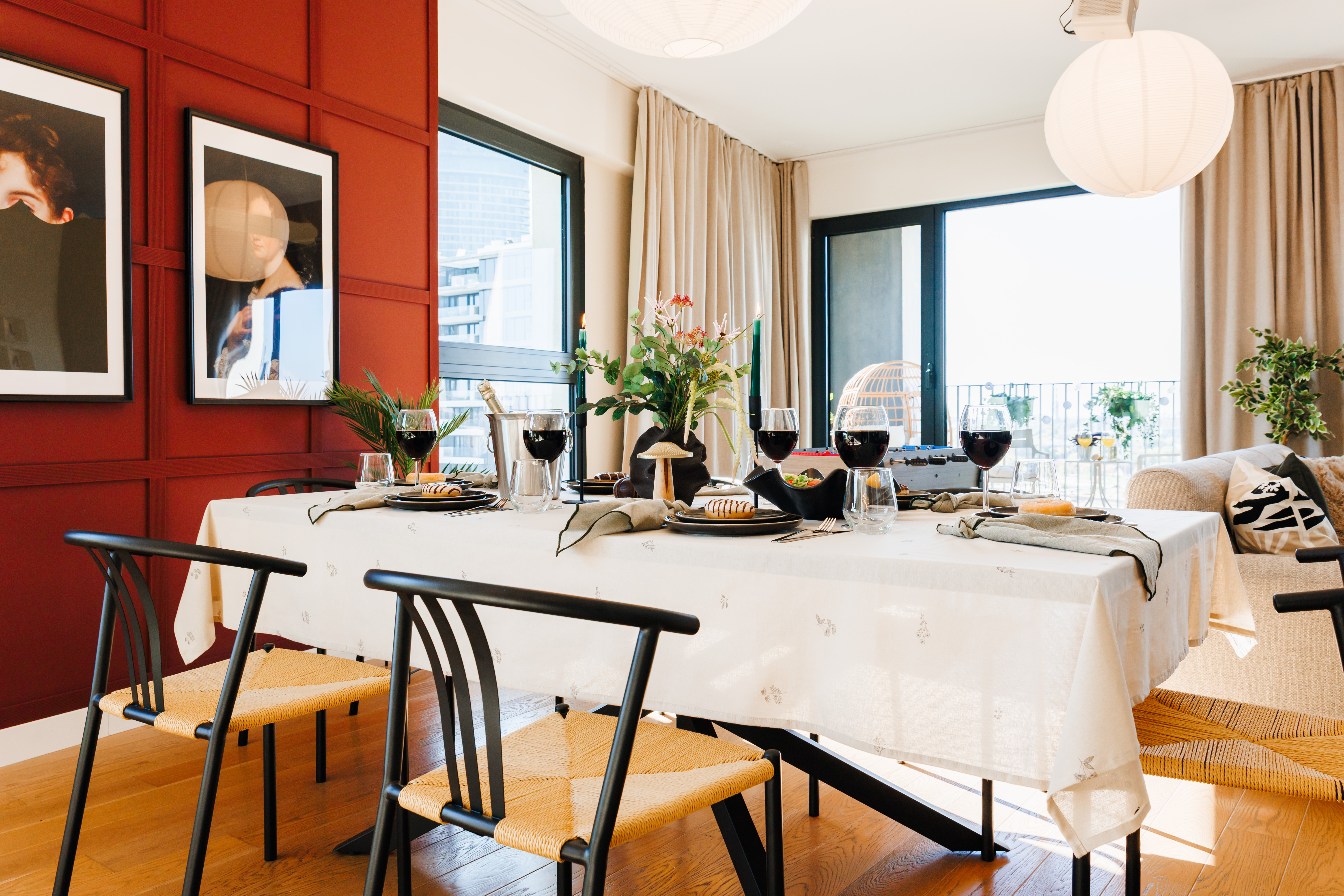 Sunlit designer dining area with balcony views and stylish seating