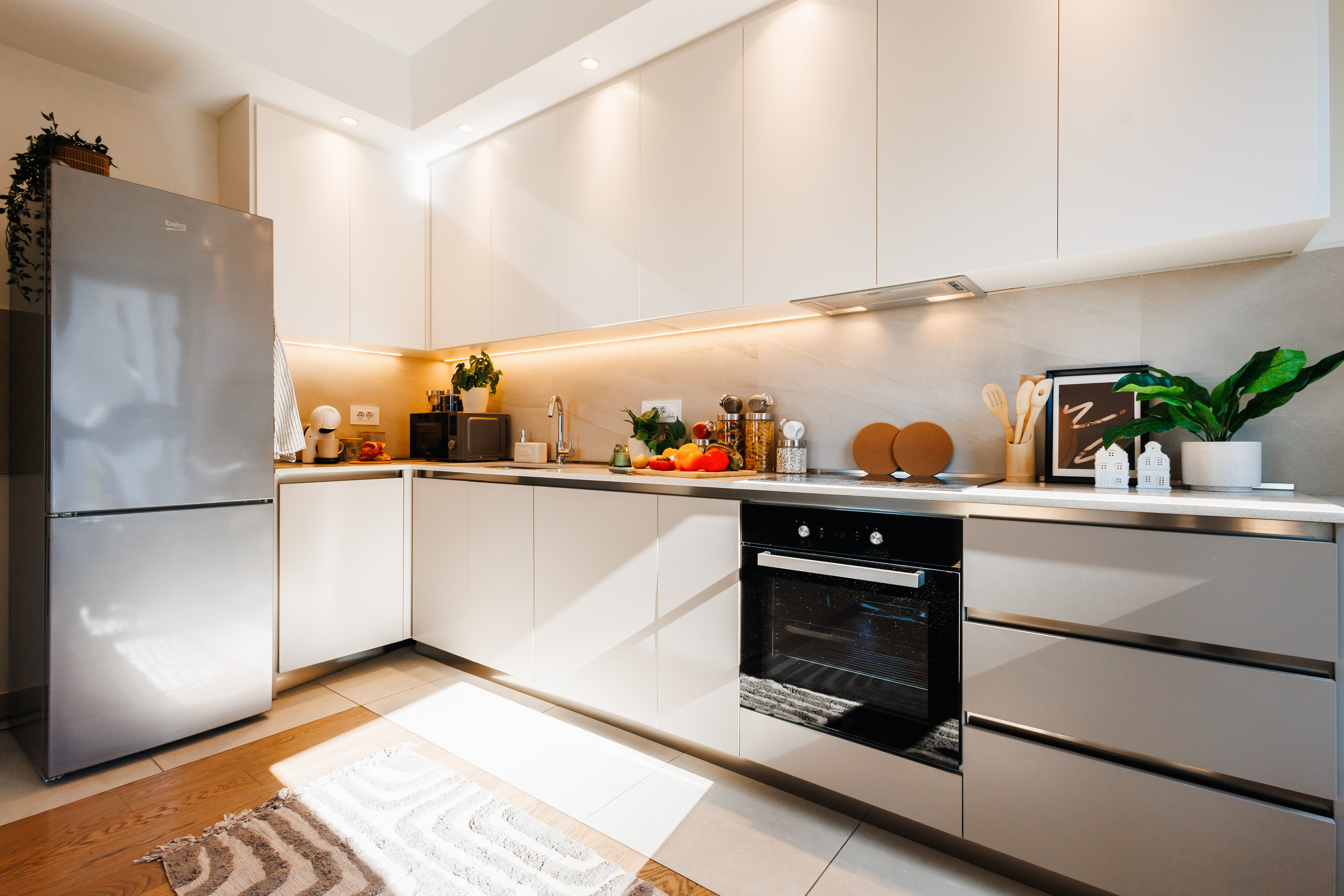 Bright modern kitchen with sleek finishes and fully equipped workspace