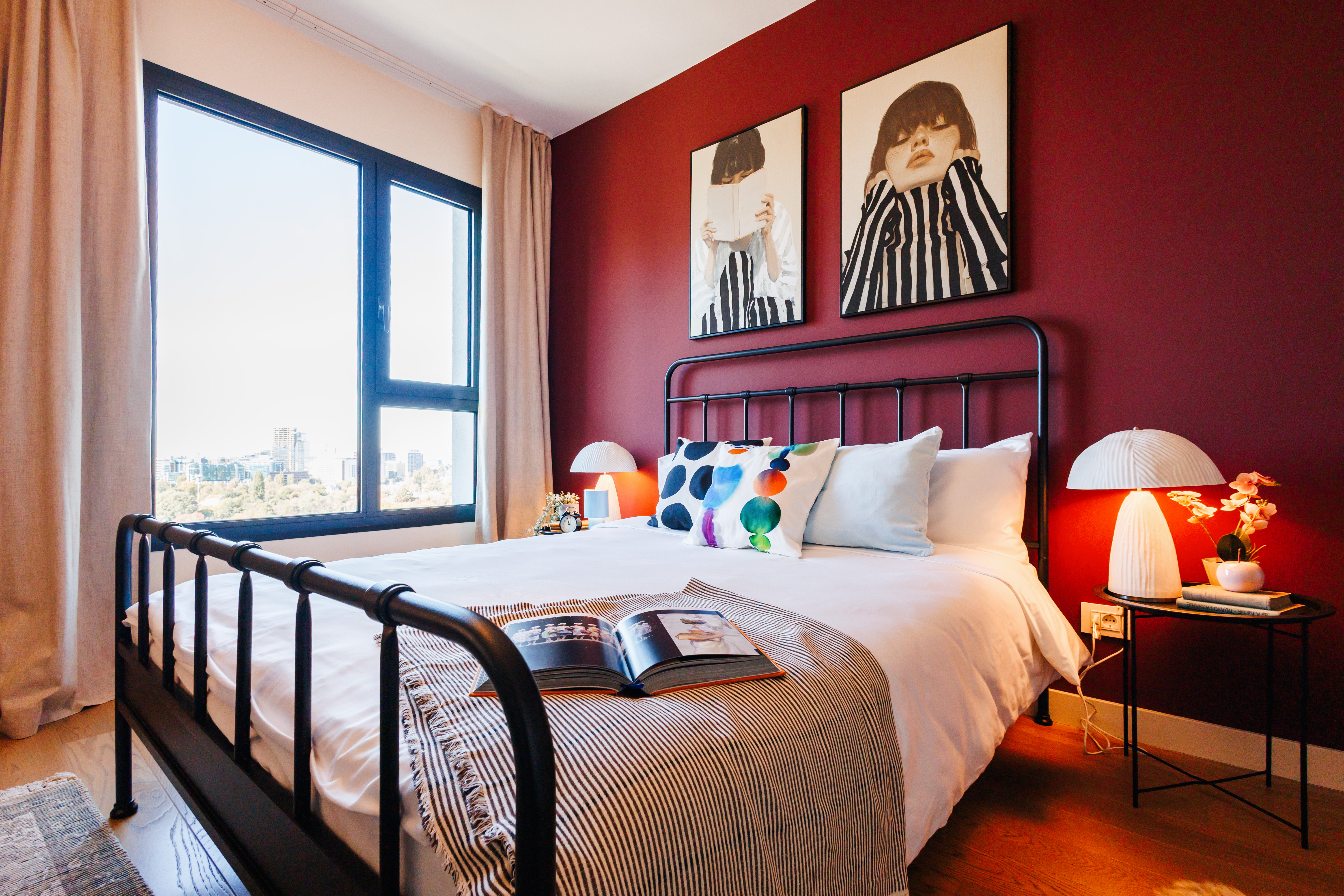 Chic city-view bedroom with bold design and abundant natural light