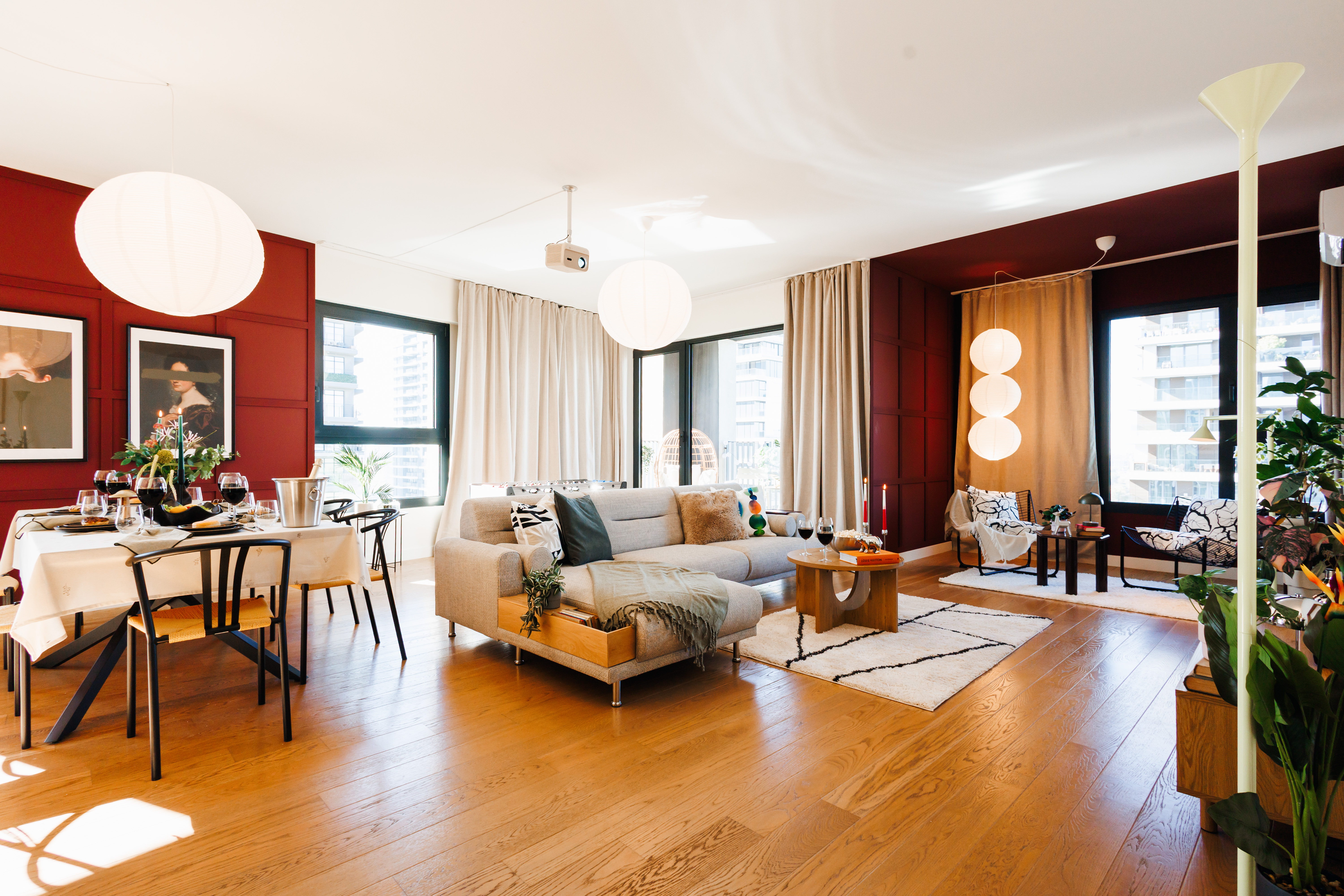 Bright designer living space with city views and stylish open-plan comfort