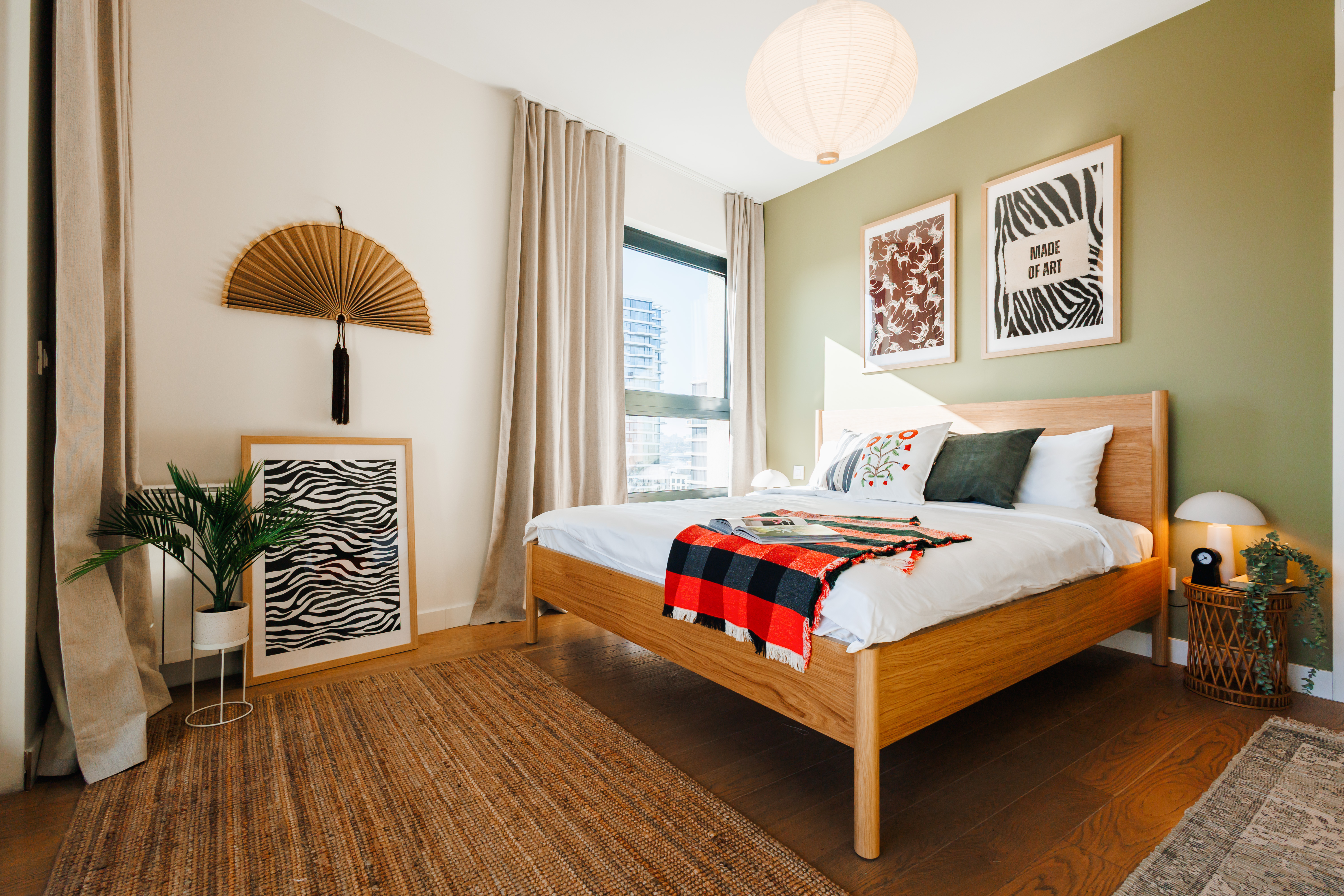 Bright designer bedroom with cozy wood accents and natural light