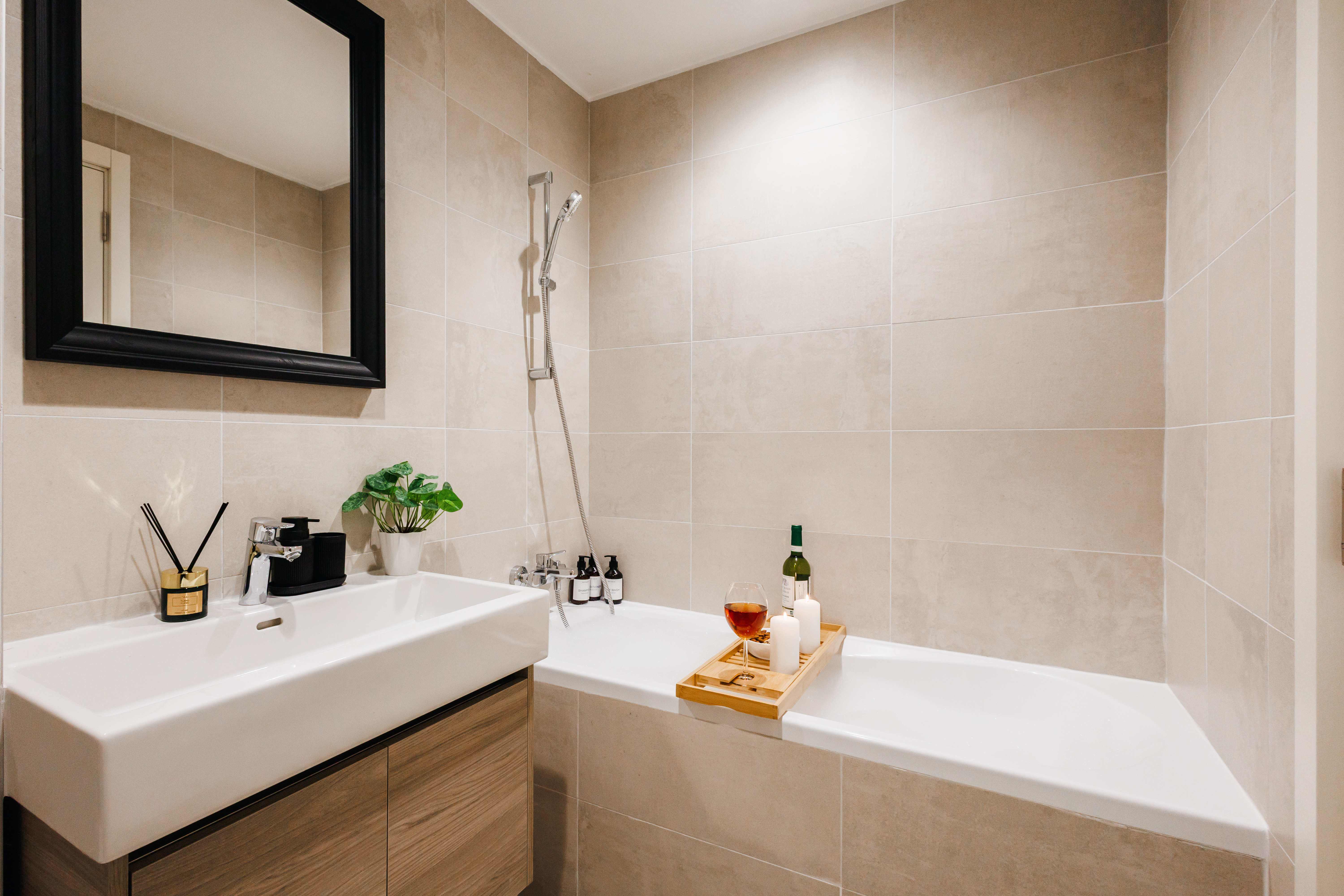 Spa-like bathroom with soaking tub, sleek vanity, and relaxing touches